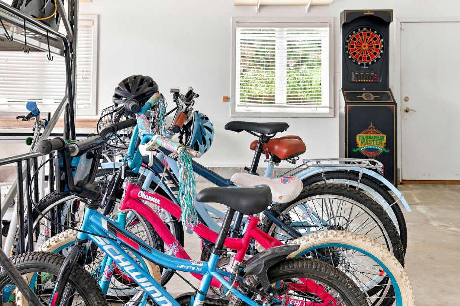 Garage bikes in family sizes with helmets for exploring Grand Beach