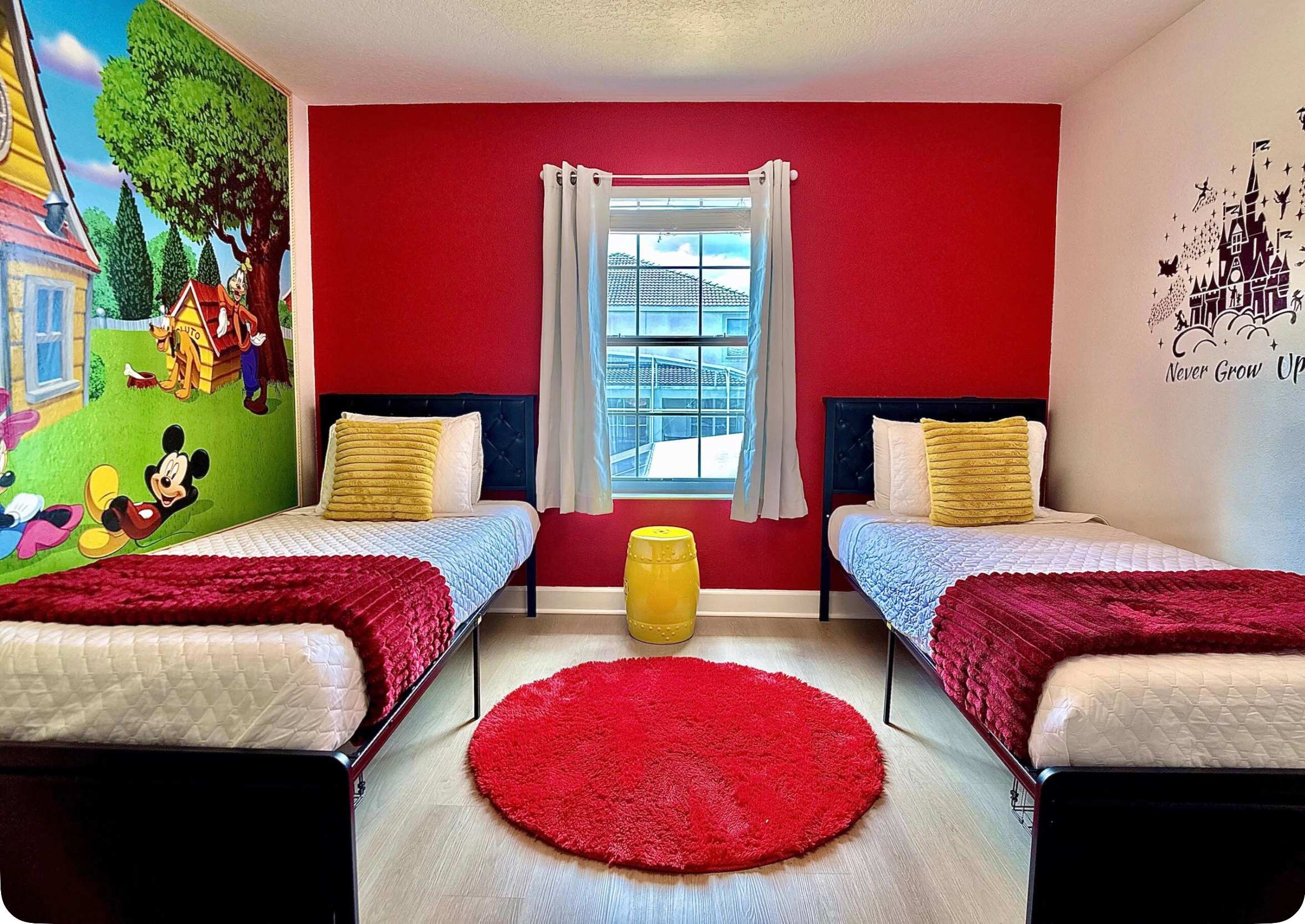 Cheerful 2 twin bedroom featuring a Mickey Mouse Clubhouse theme and Smart TV