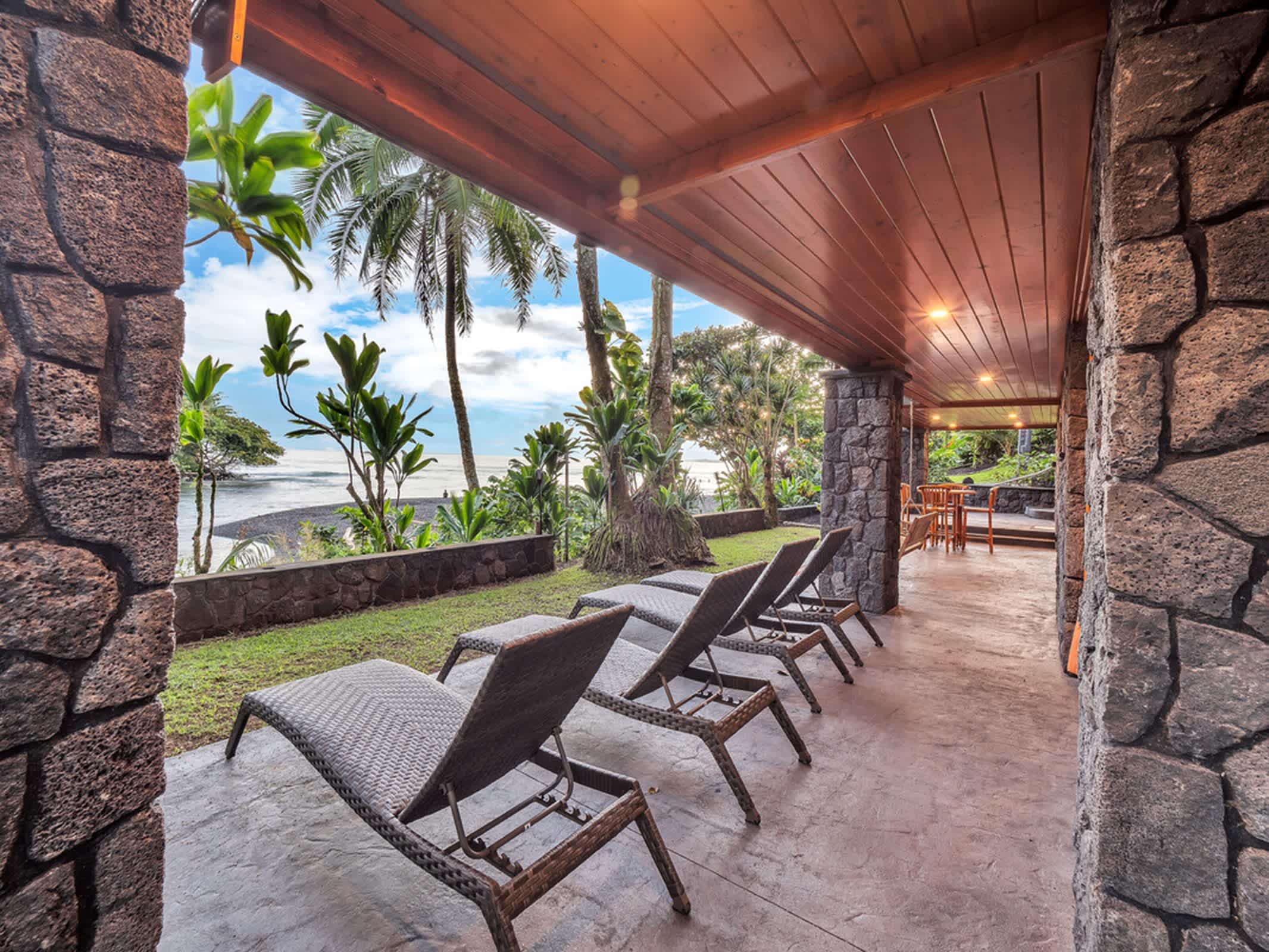 Enjoy peaceful waterfront views from the comfortable lounge chairs
