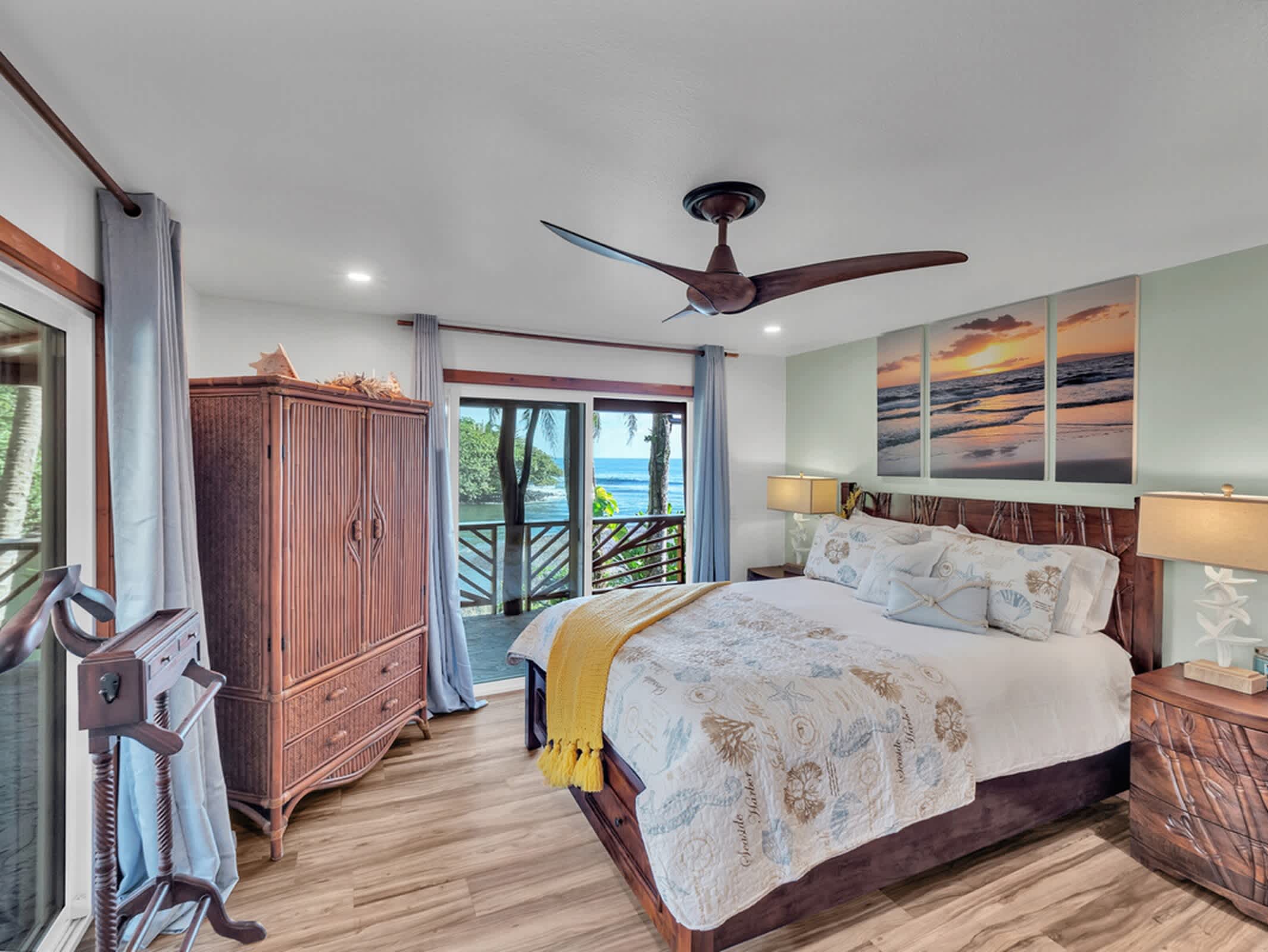 Queen bedroom with balcony access and beautiful beach views