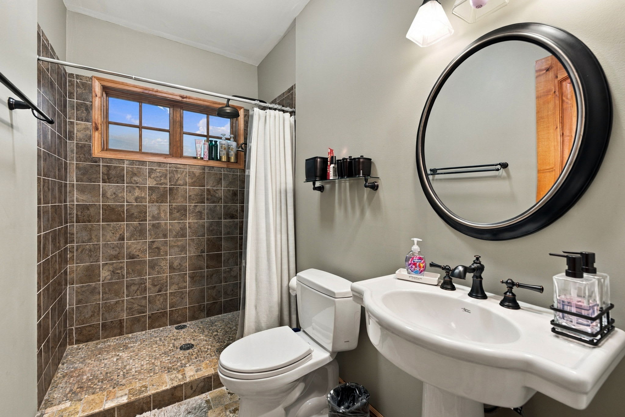 Bathroom 2 (main level): Full bathroom with shower