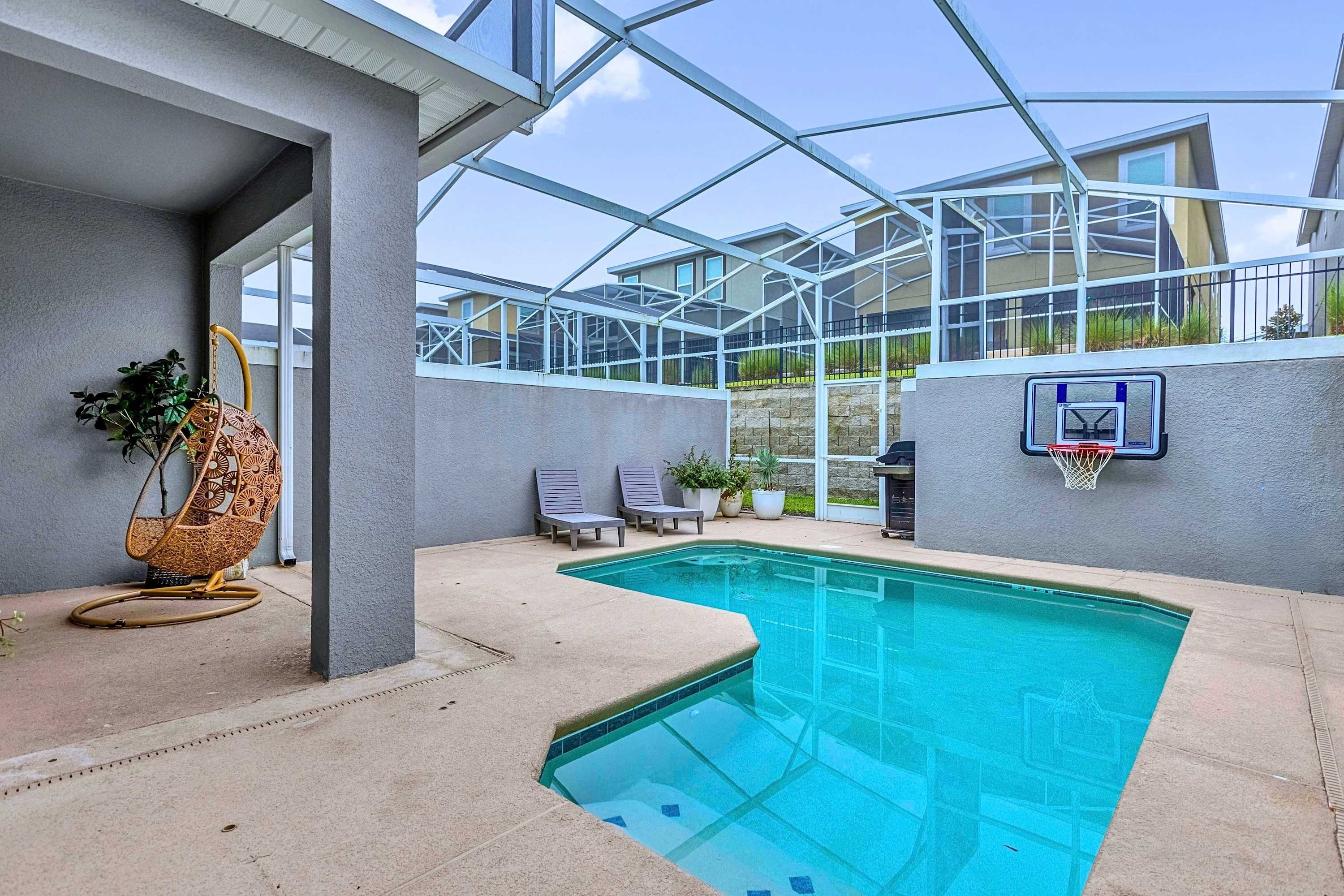 Cook out poolside! Enjoy the BBQ, water hoops, lounge chairs, and a cozy swing chair.