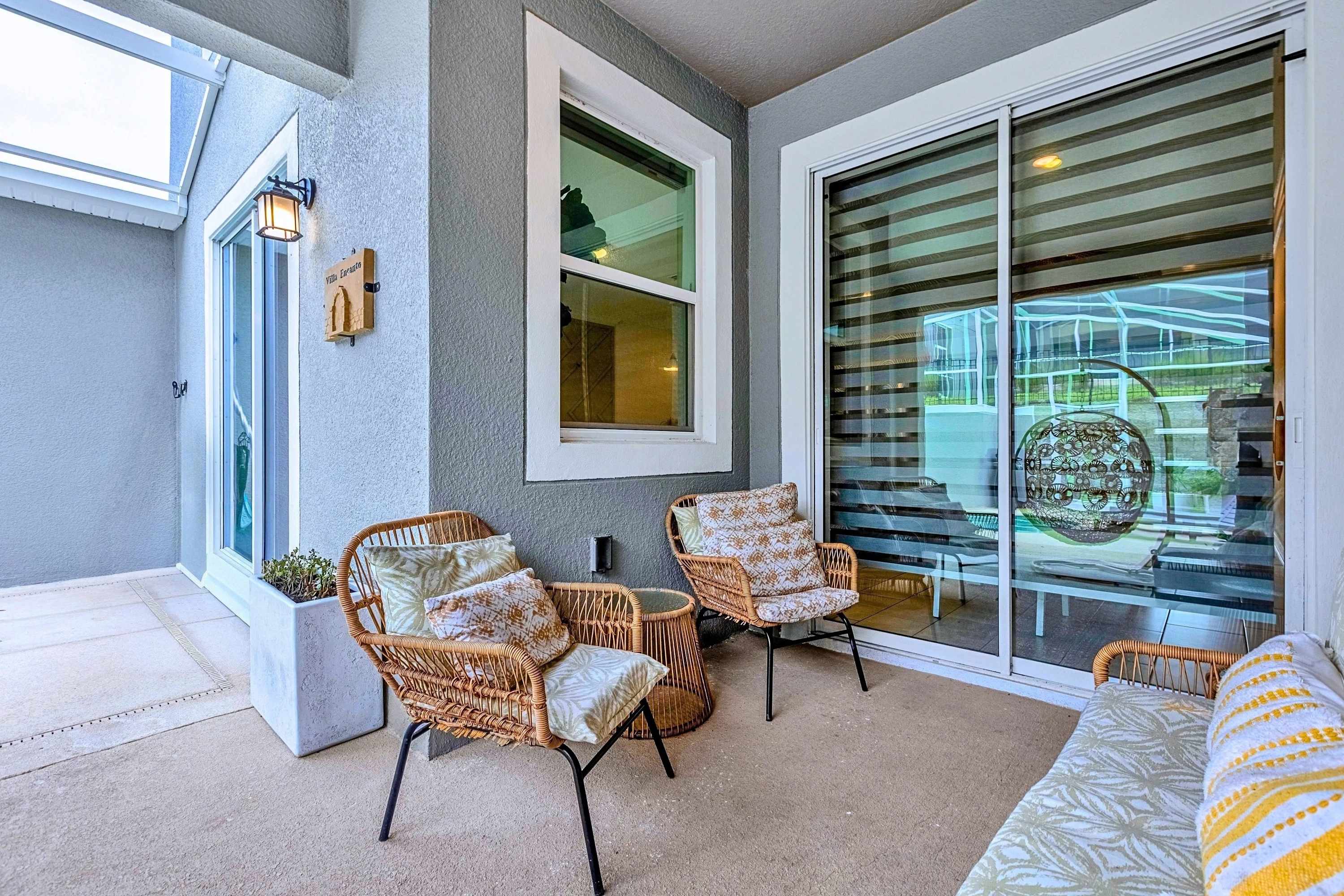 Covered outdoor lounge deck with direct entry points into the main home living space.