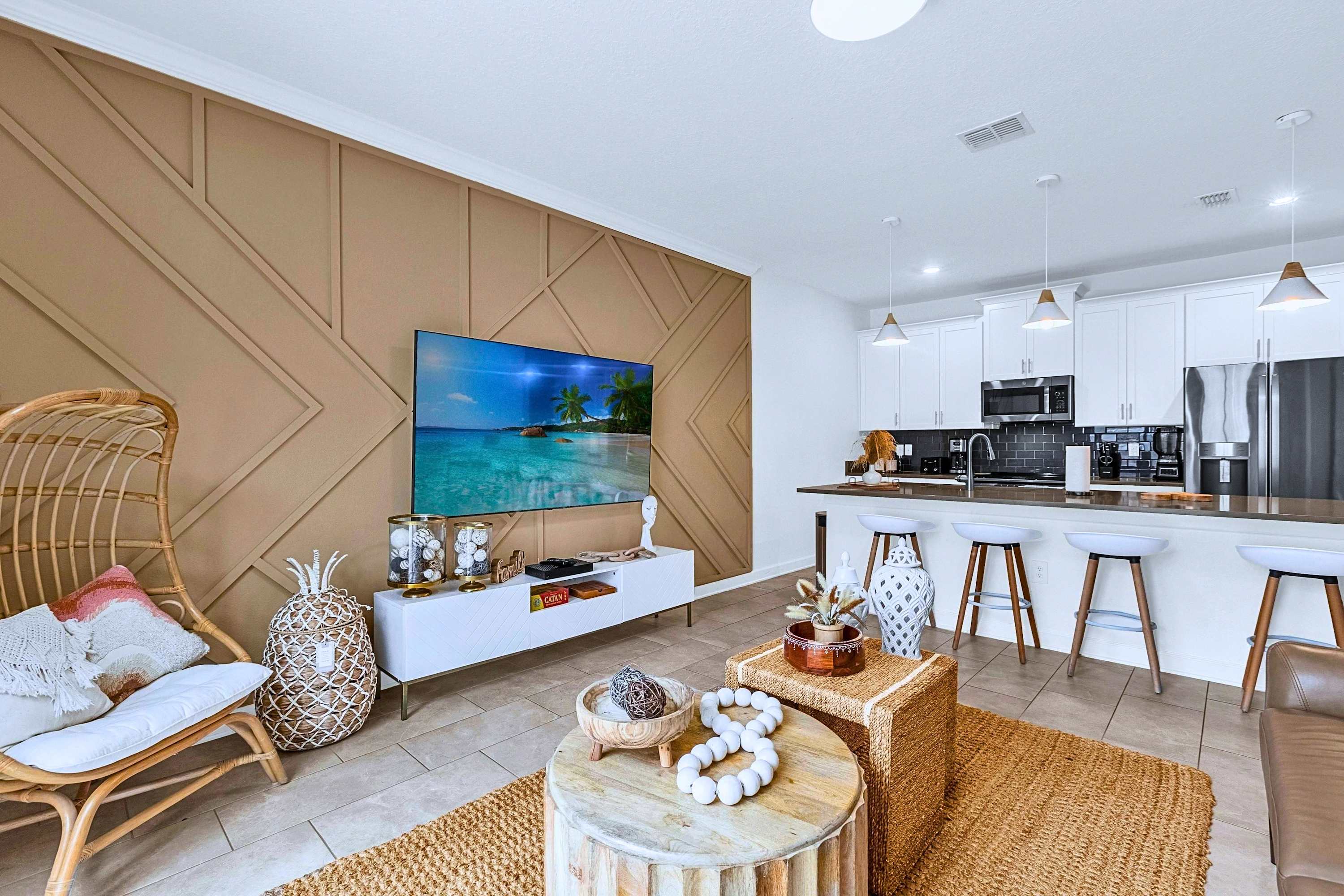 Relax on the couch or gather around the kitchen island with seating for 4 just steps away.