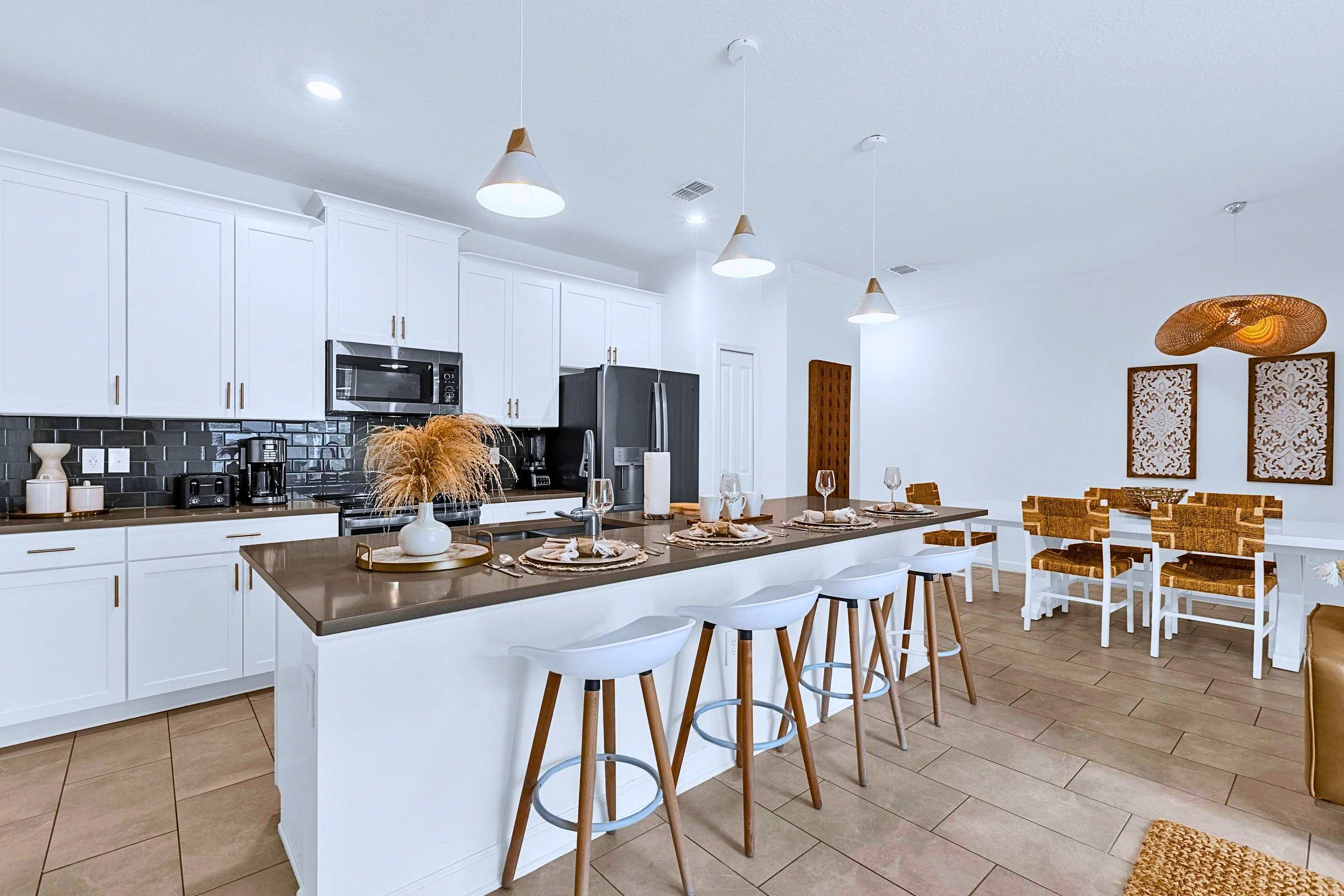 Gather around the kitchen island for quick bites, coffee, or pre-dinner drinks.