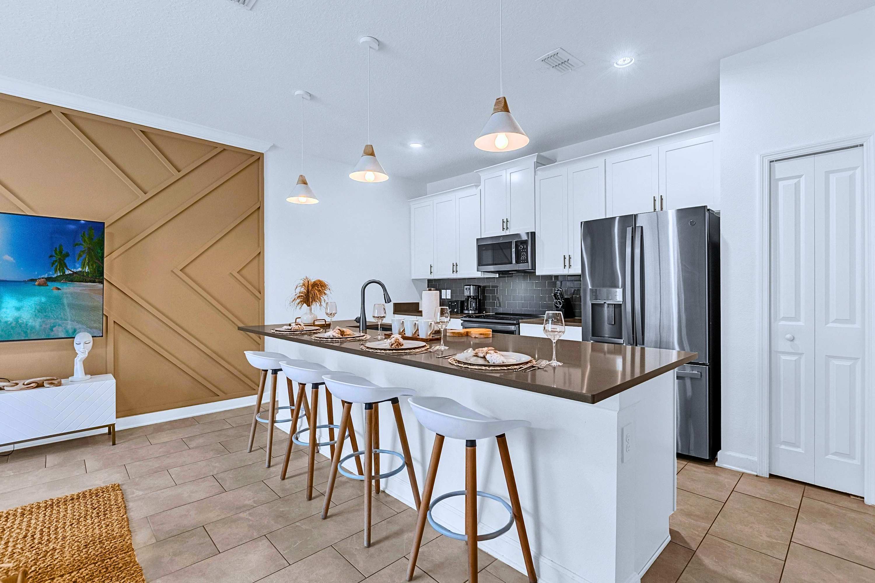 Enjoy breakfast together at the central kitchen island with seating for 4.