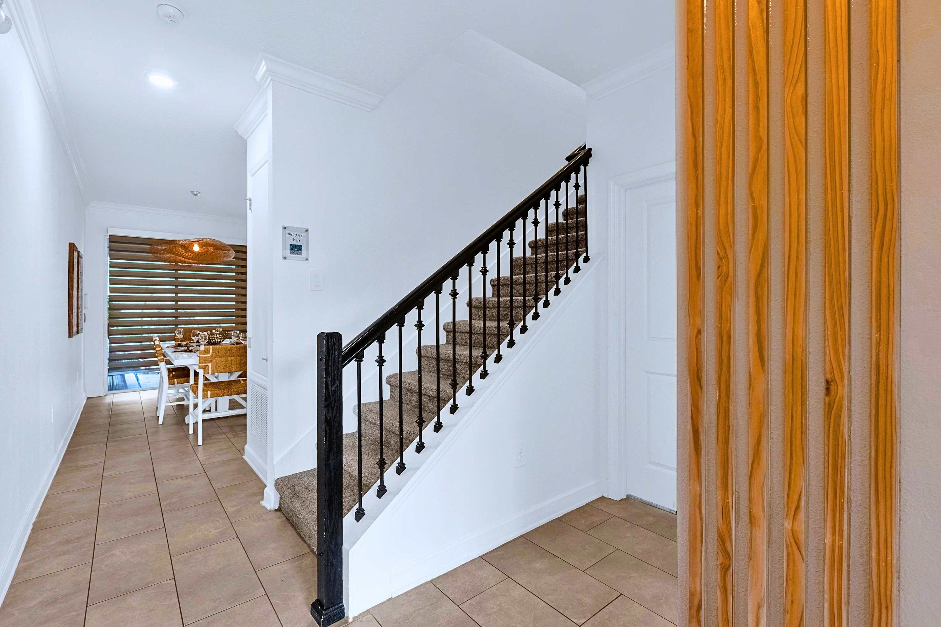 Main staircase providing easy access to the second-floor bedrooms and full bathrooms.