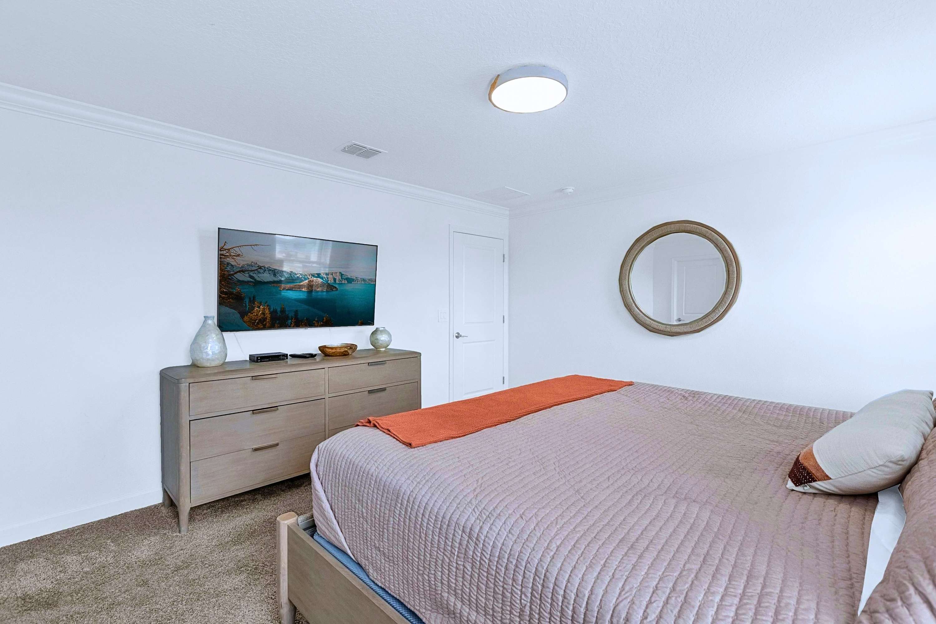 Relax in bed with your favorite TV shows in this beautifully decorated Queen bedroom.