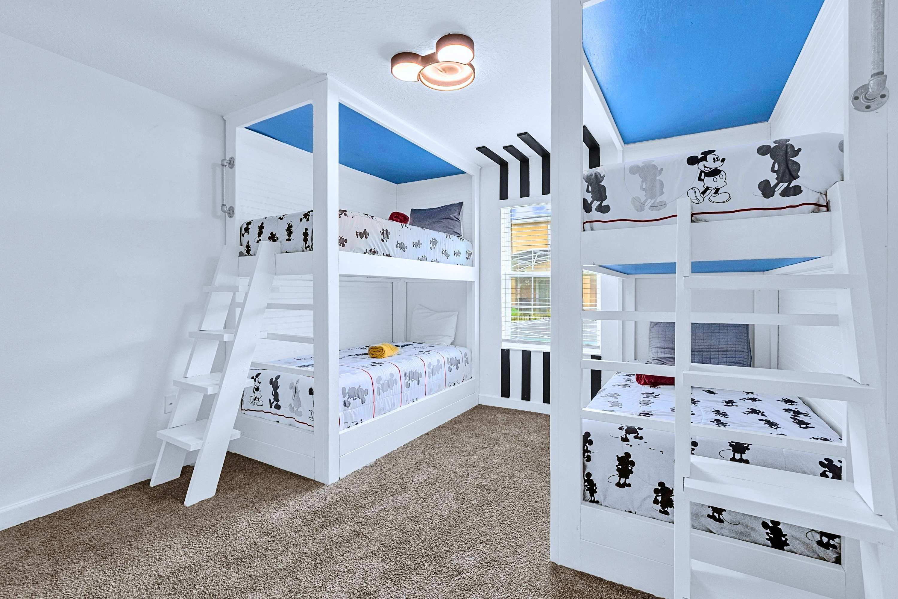 Magical theme room! Kids will love staying in this custom Mickey Mouse bunk room.