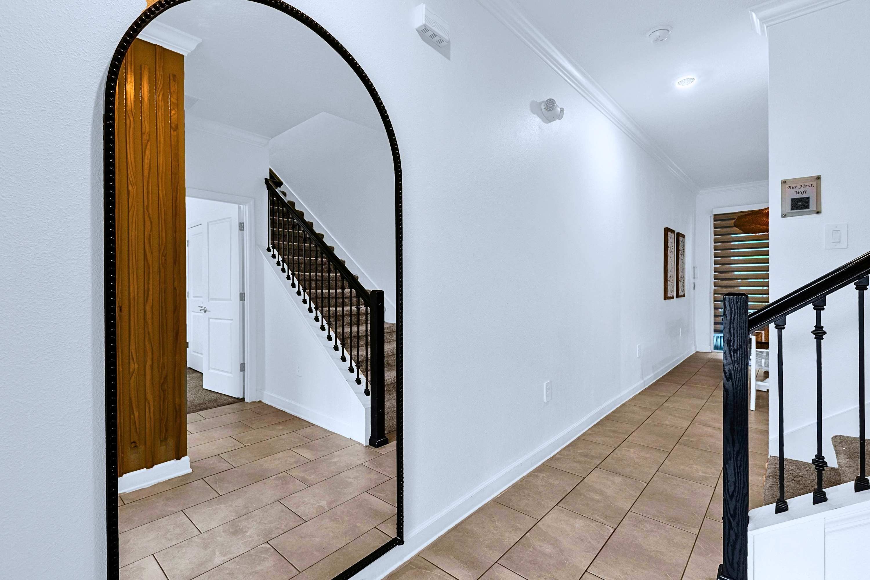 Entryway area featuring a large full-length vanity mirror for last-minute checks.