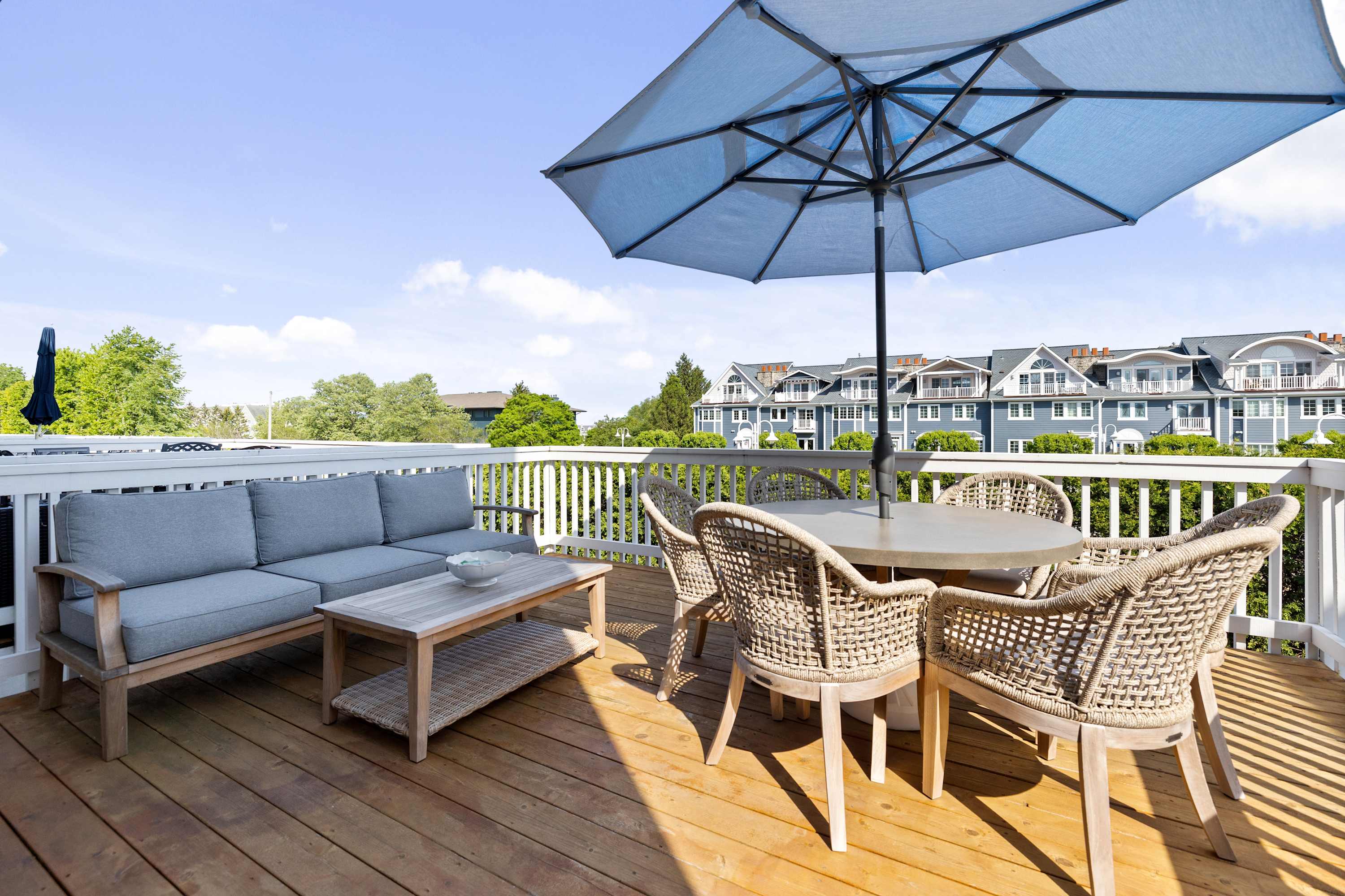 Deck with separate lounge and dining areas for the whole group.