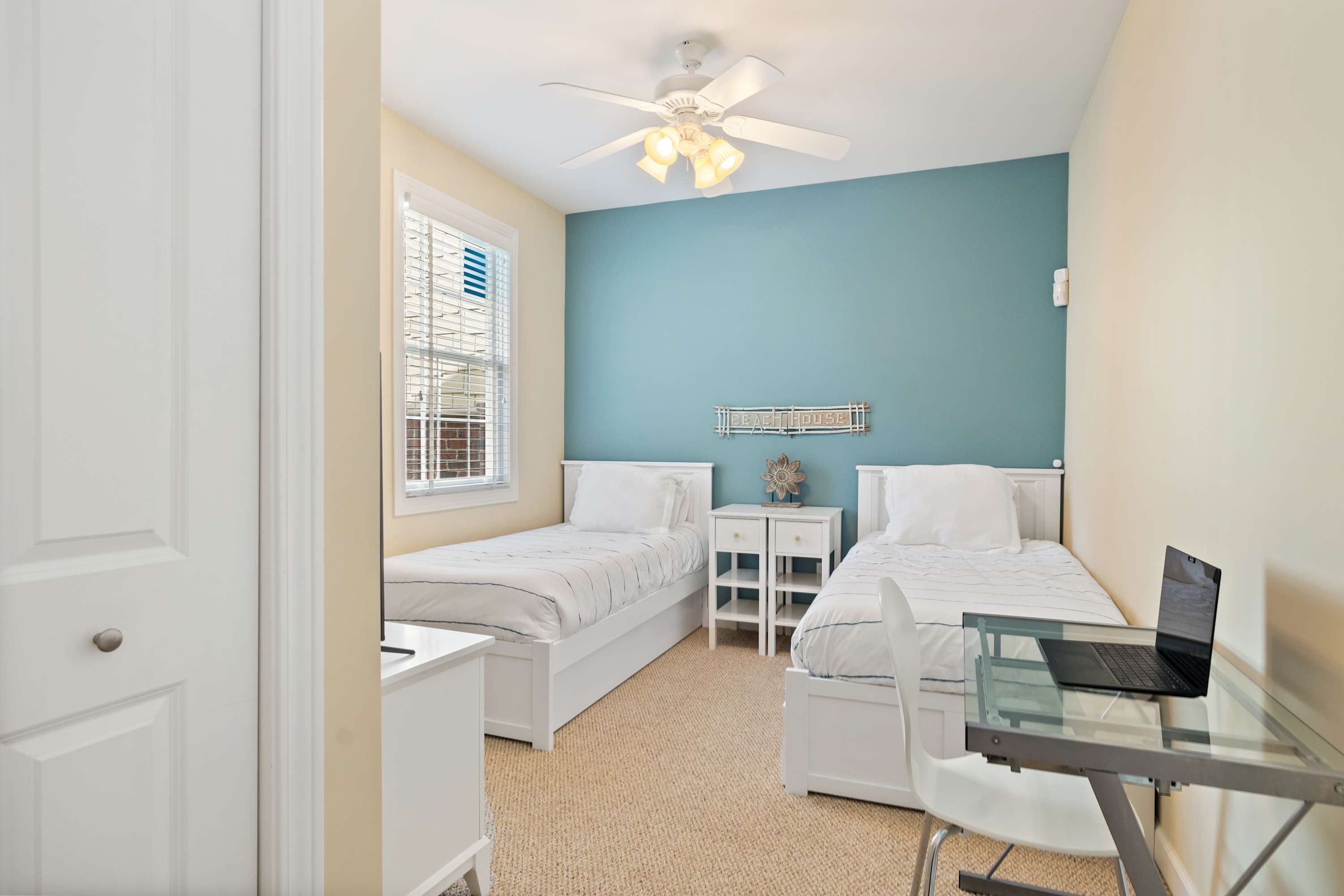 Sea Glass twin room with a workspace for checking in on the office.