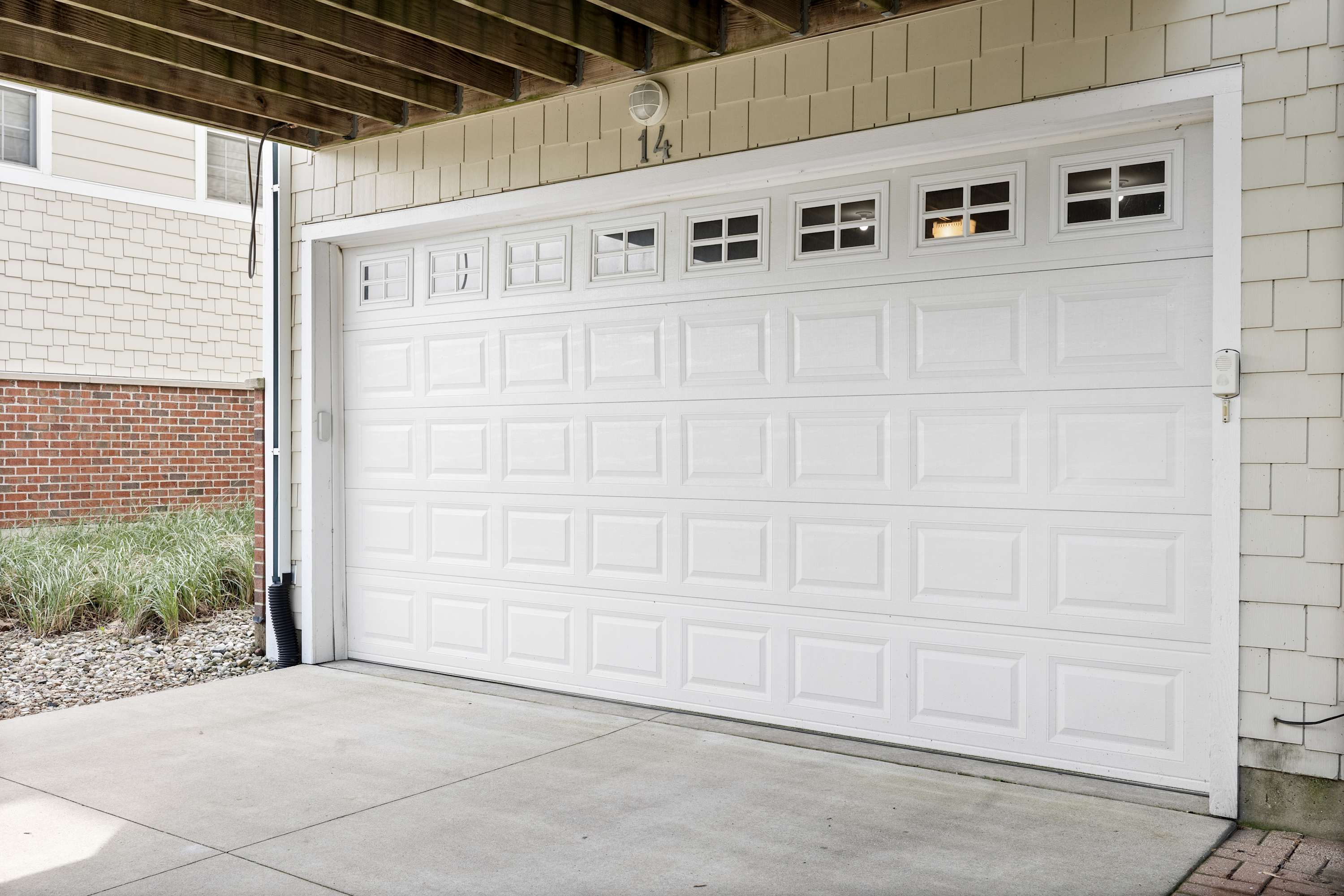 Sea Glass garage with space for two vehicles and an EV charger.