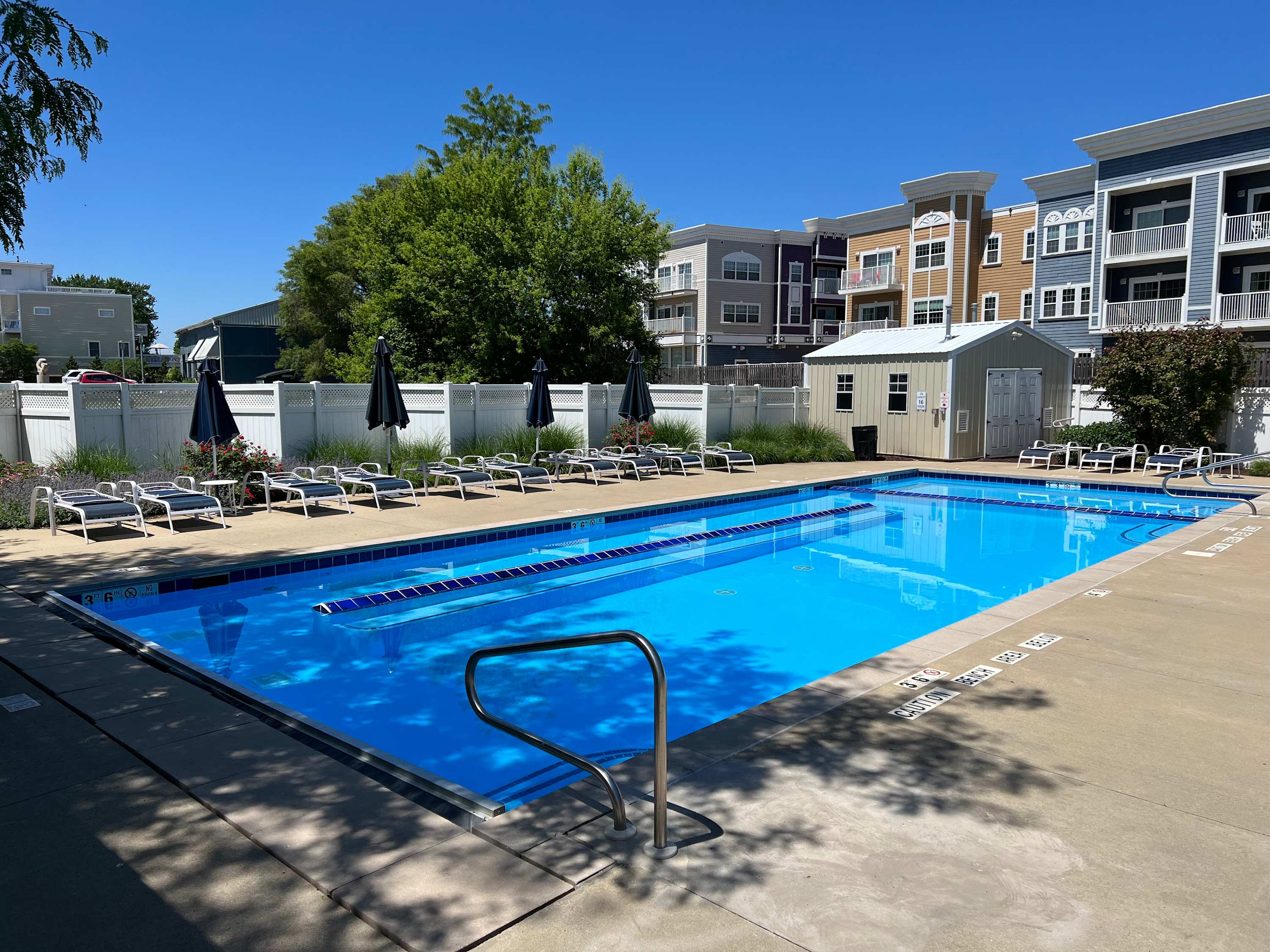 Sea Glass guests have community pool access with plenty of lounge seating.