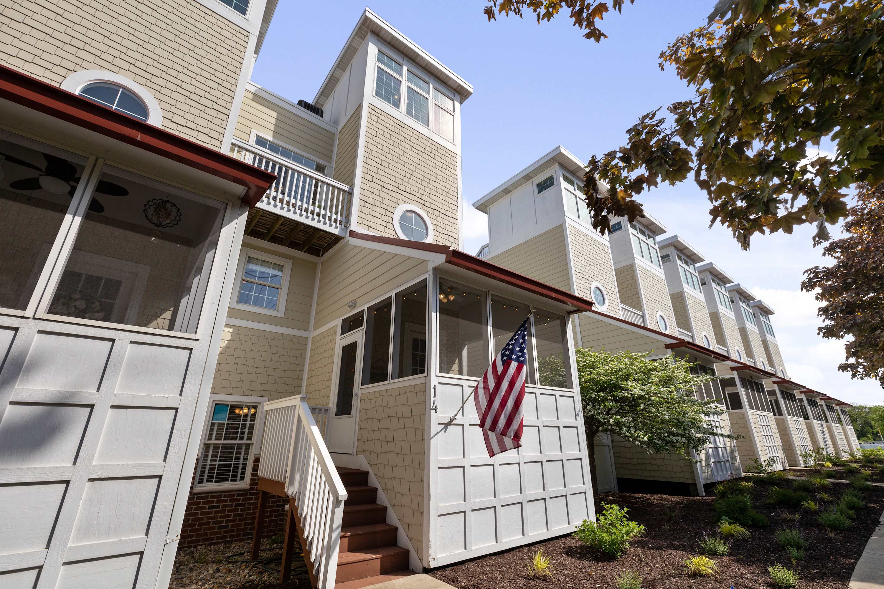 Sea Glass townhome in New Buffalo with a front porch and attached garage.