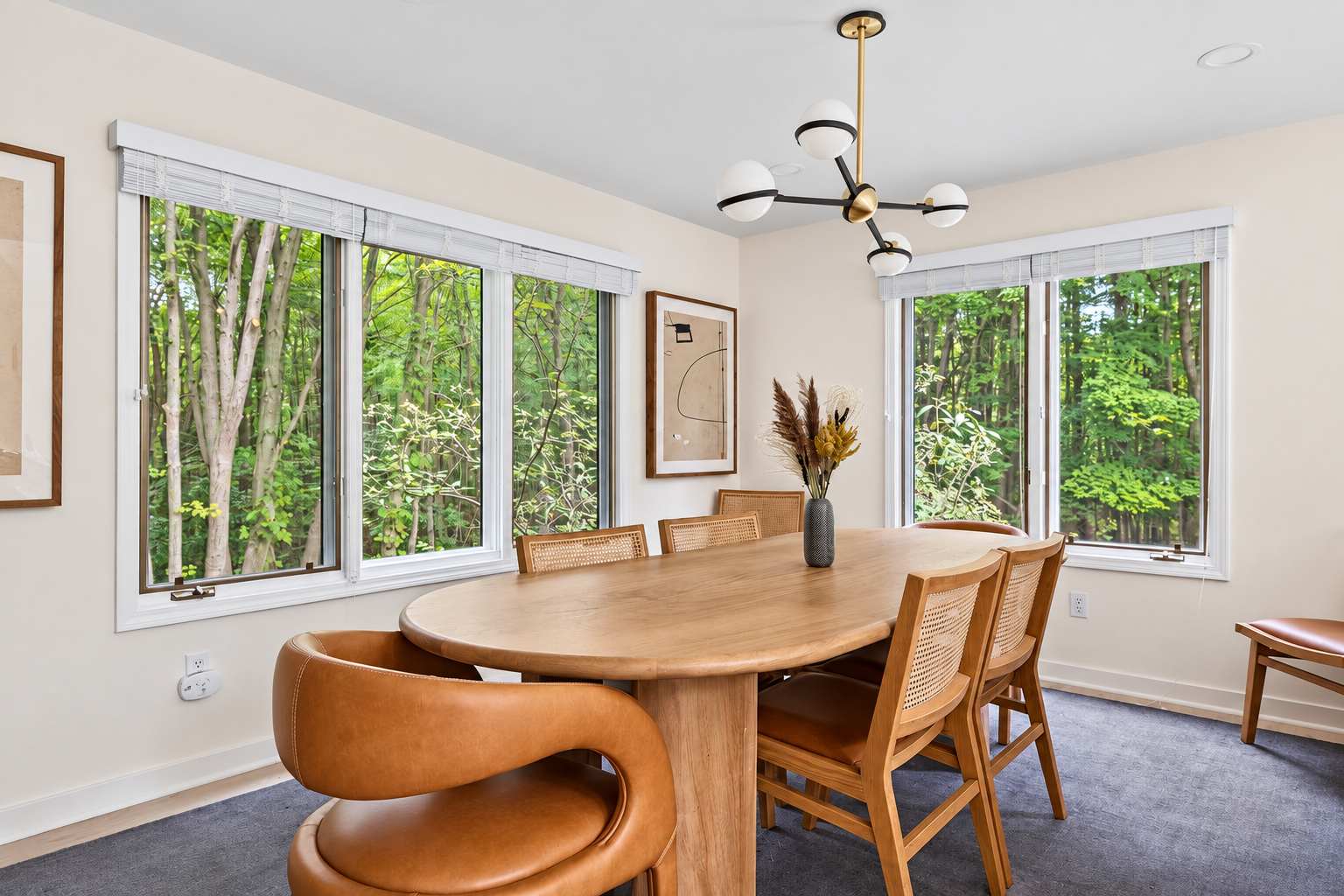 Gather around the dining table with peaceful wooded views