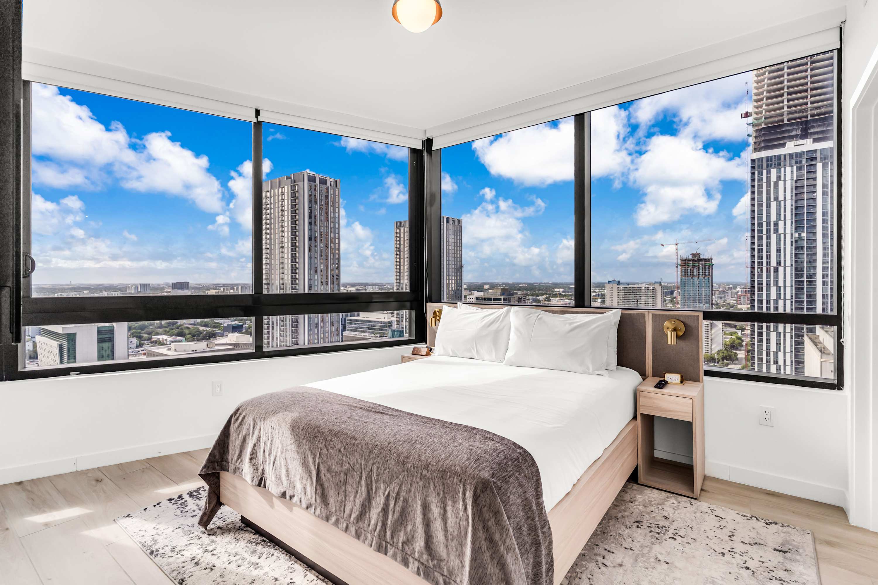 The queen suite boasts a smart TV, an ensuite, & gorgeous skyline views