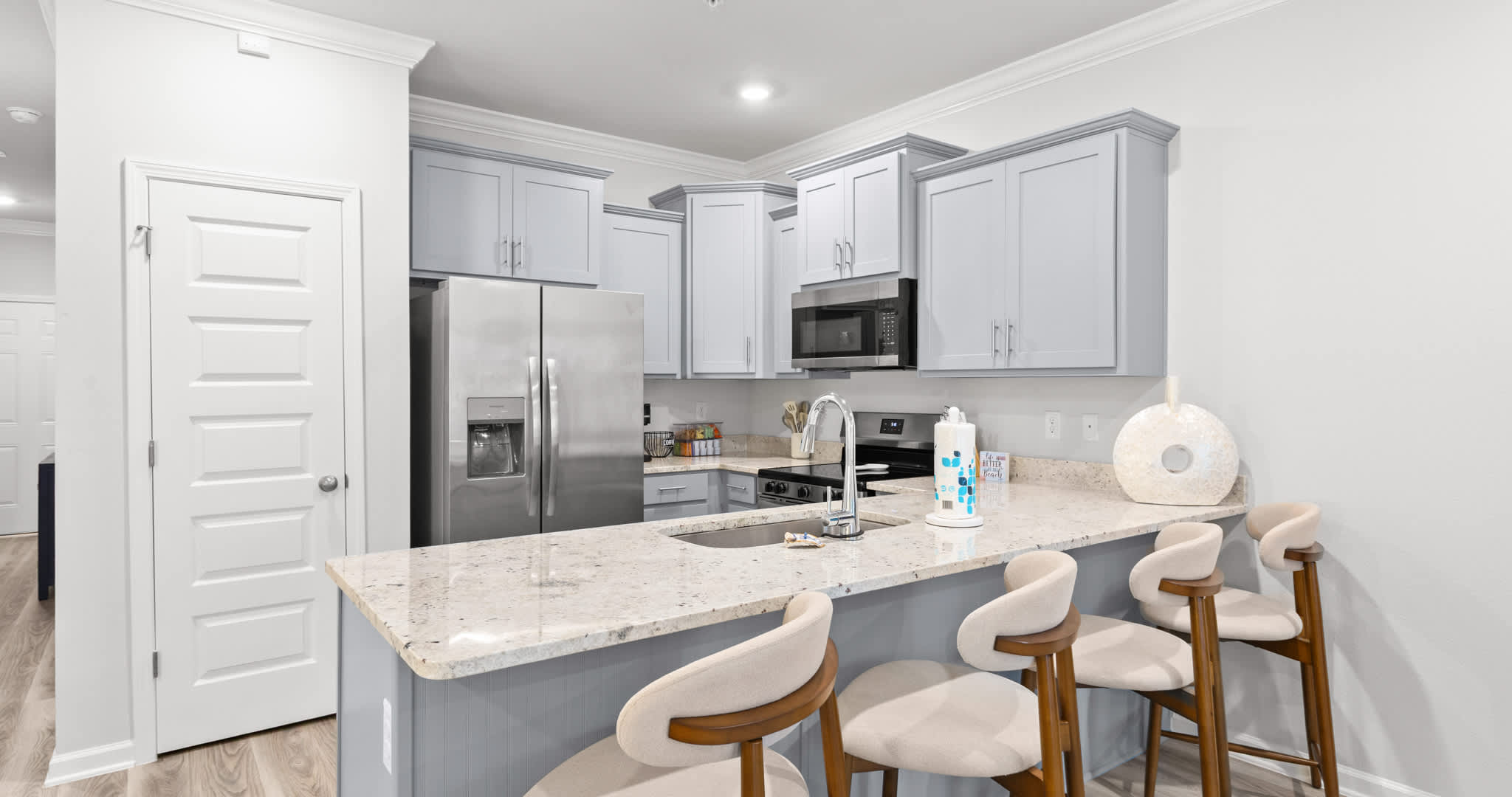 The open kitchen offers ample space & all the comforts of home​