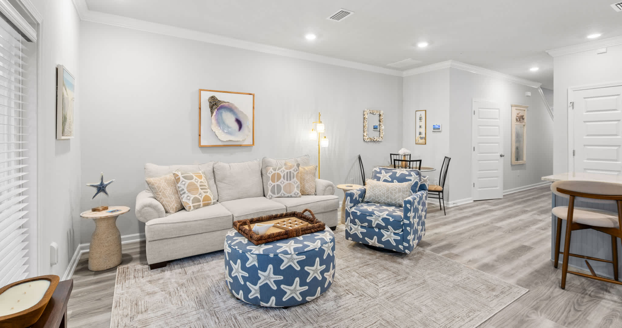 Unwind in the coastal chic living room & stream your favorites on the smart TV​