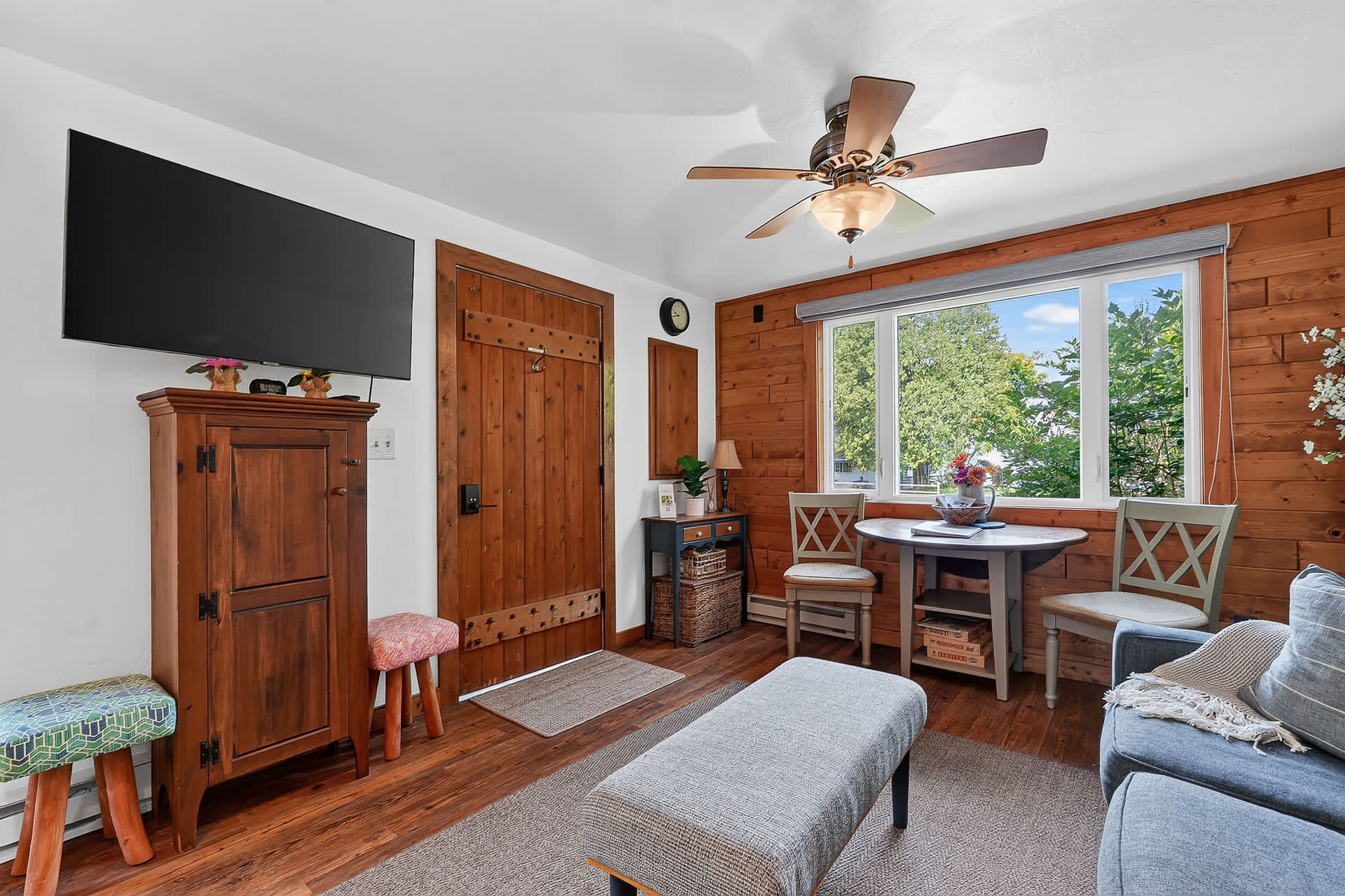 Living room with Breakfast table and TV. Views of Eagle Harbor from the Living room!