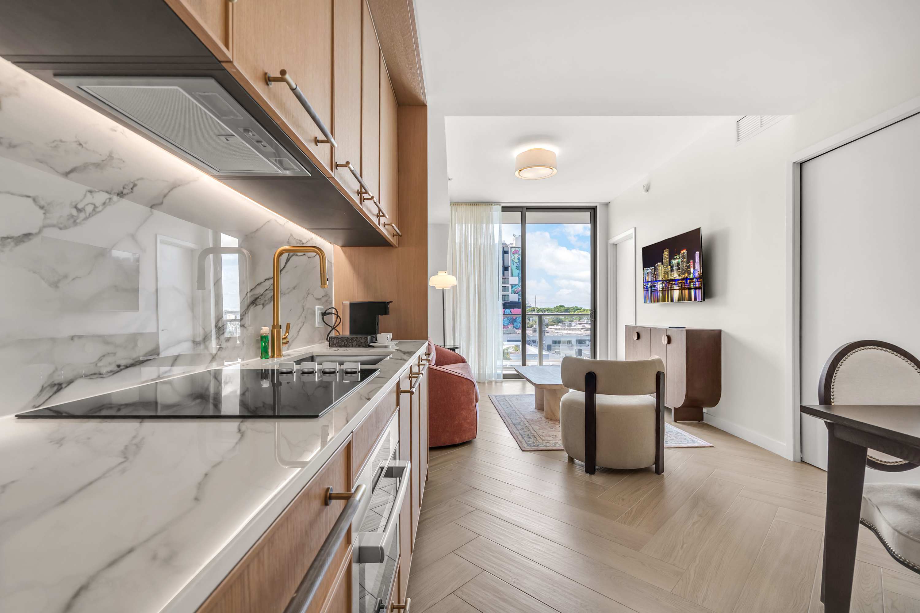 The sleek, open kitchen is well equipped for an unforgettable getaway​