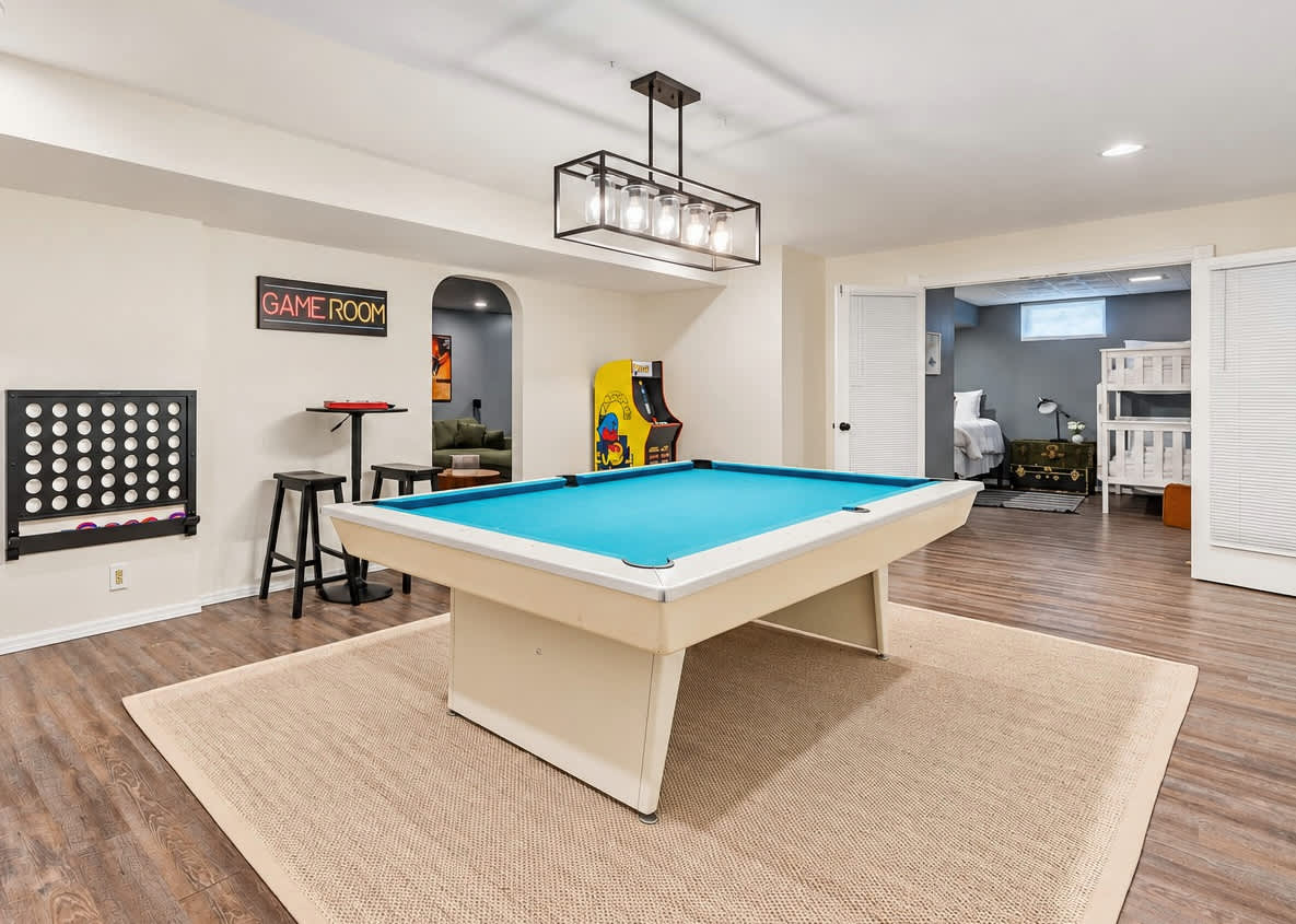 The lower level game room keeps the fun going long after the pool day ends