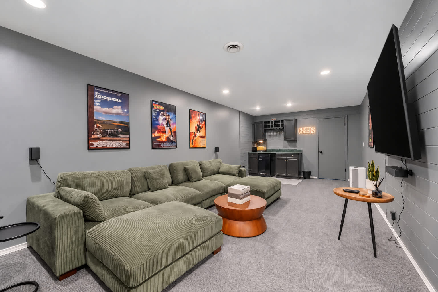 Stretch out on the media room sectional for a movie on the 75” screen smart TV with surround sound