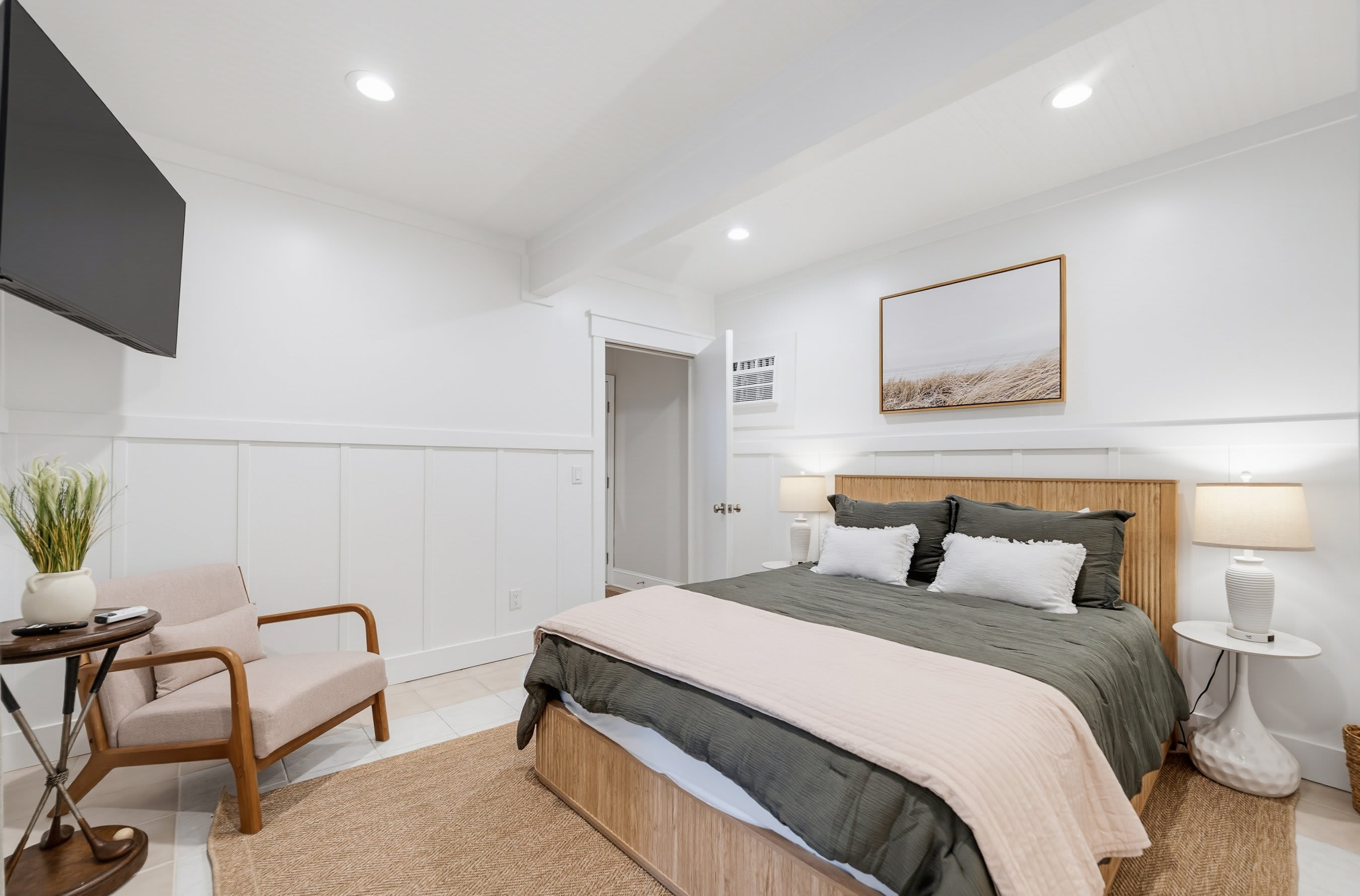 Ground Level Queen Bedroom with Full En Suite Bathroom and Access to Screened Patio