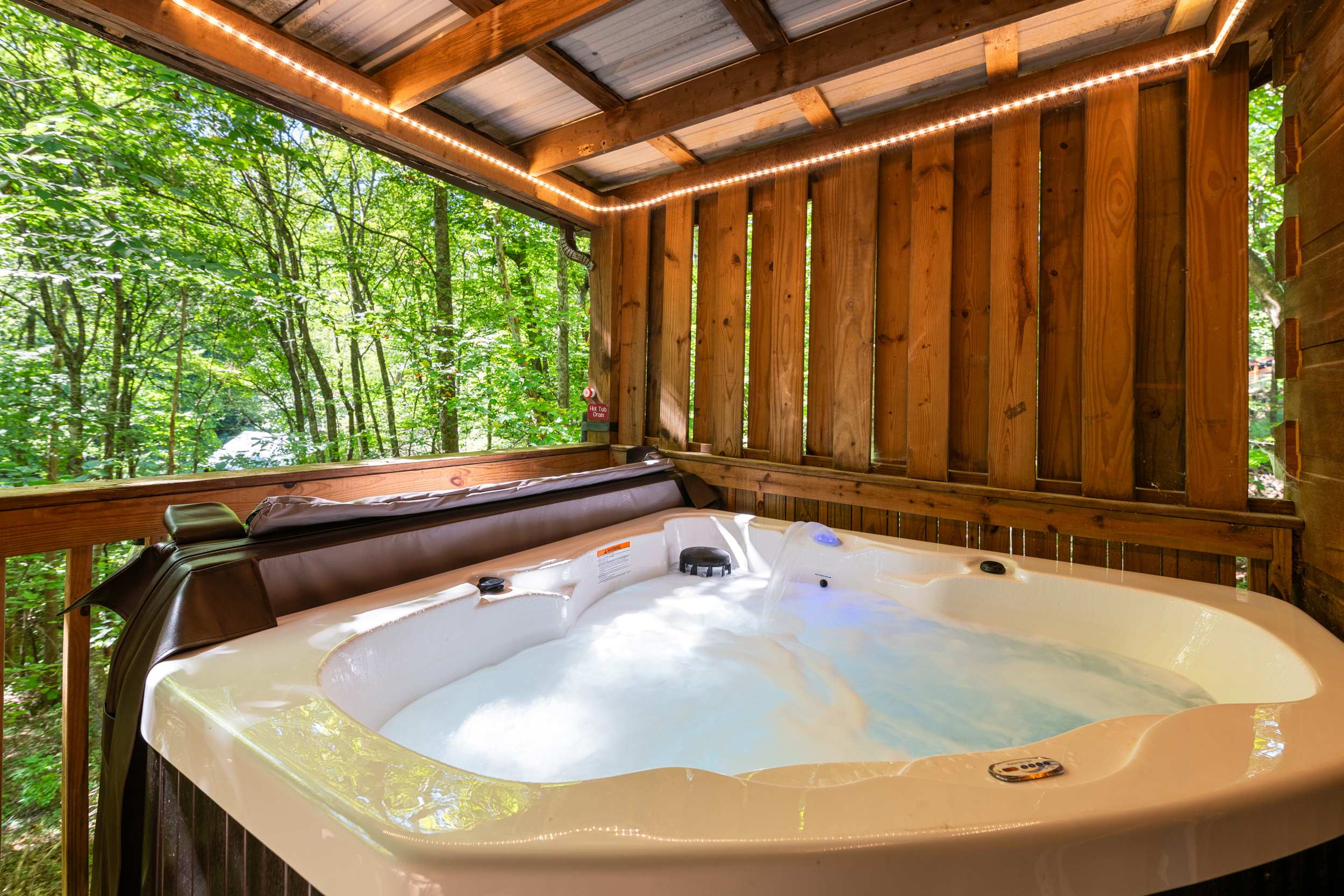 Soak and relax in the hot tub while enjoying nature views.