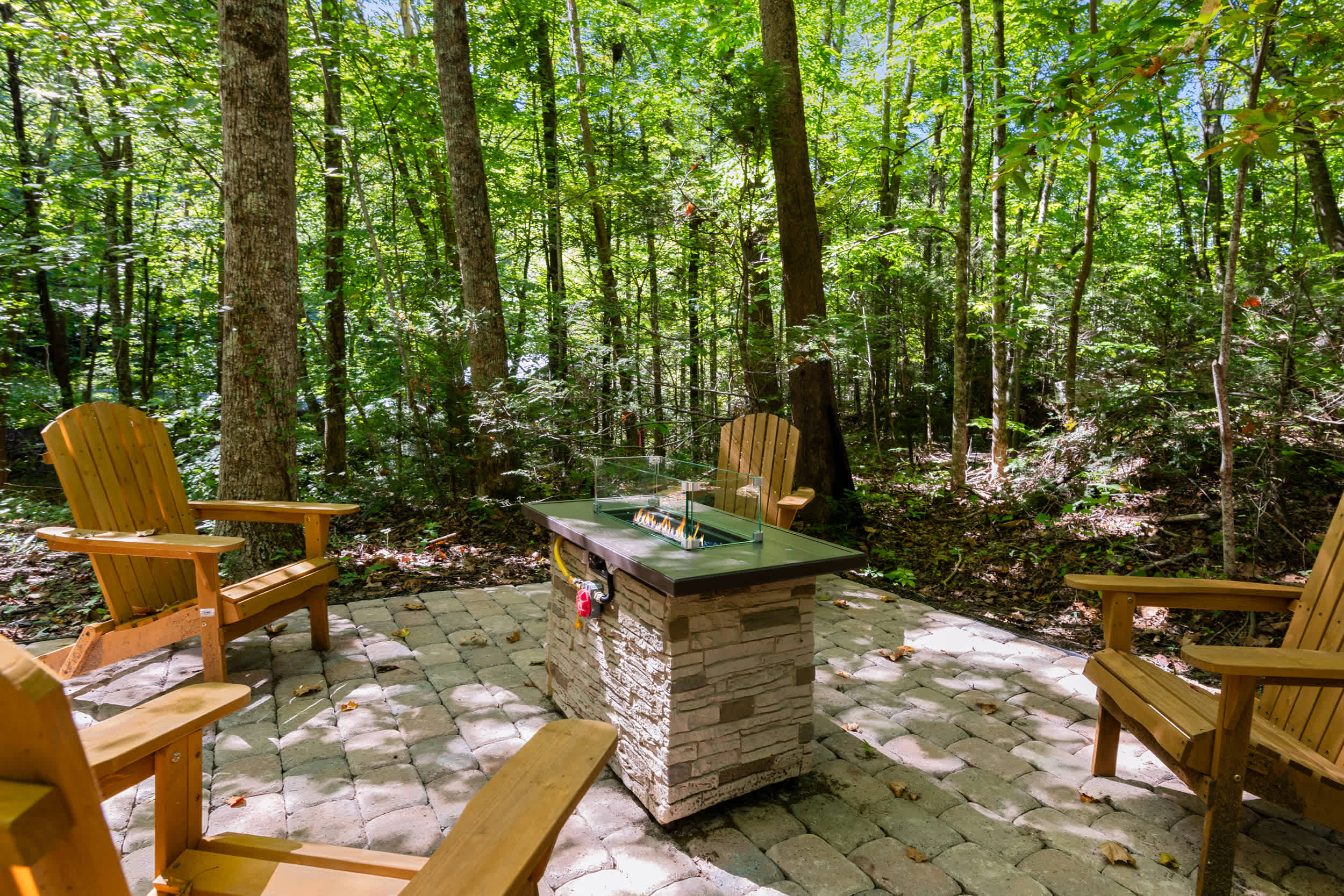 Gather around the outdoor firepit for cozy nights with family and friends.
