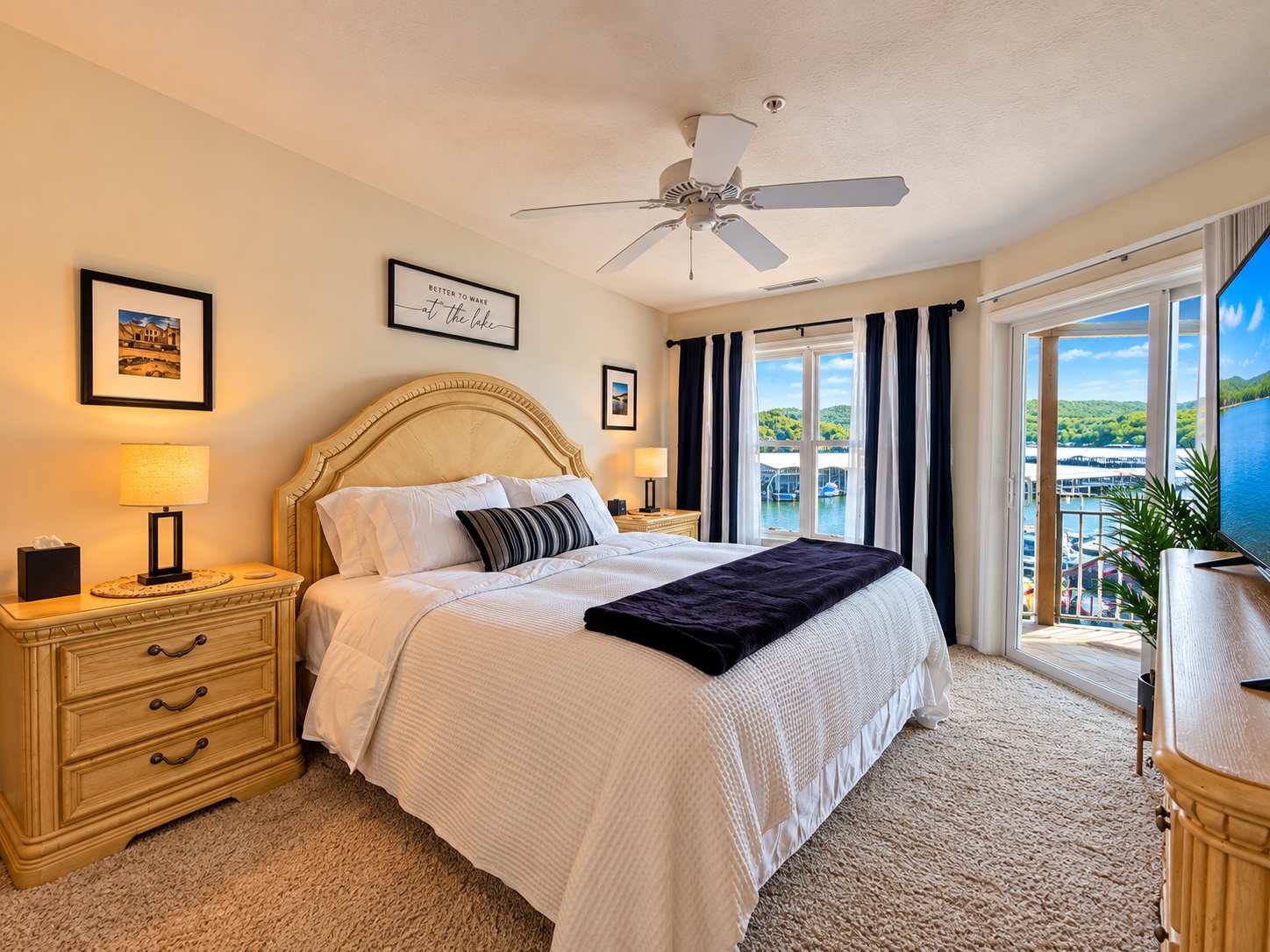 The primary king suite boasts a smart TV, private ensuite, & deck access​
