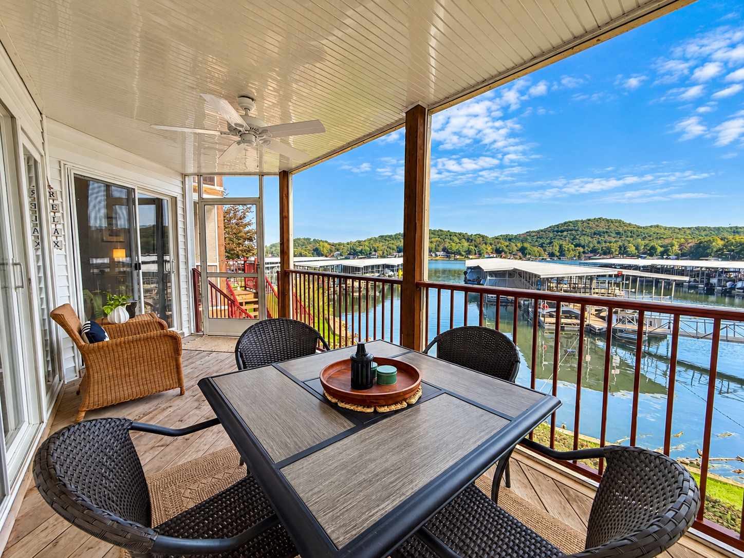 Lounge the day away or dine alfresco with lake views on the screened deck​