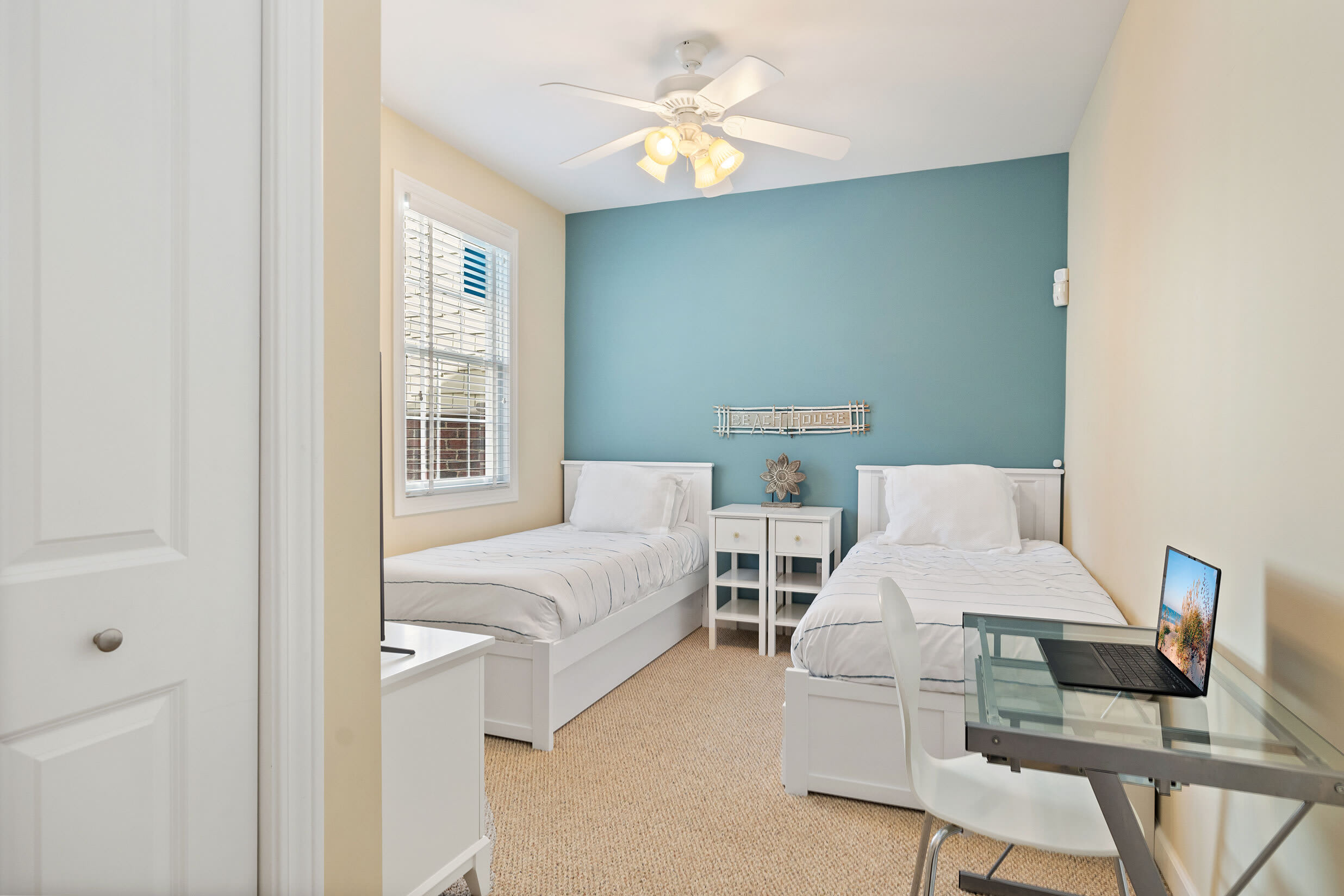 Sea Glass twin room with a workspace for checking in on the office.
