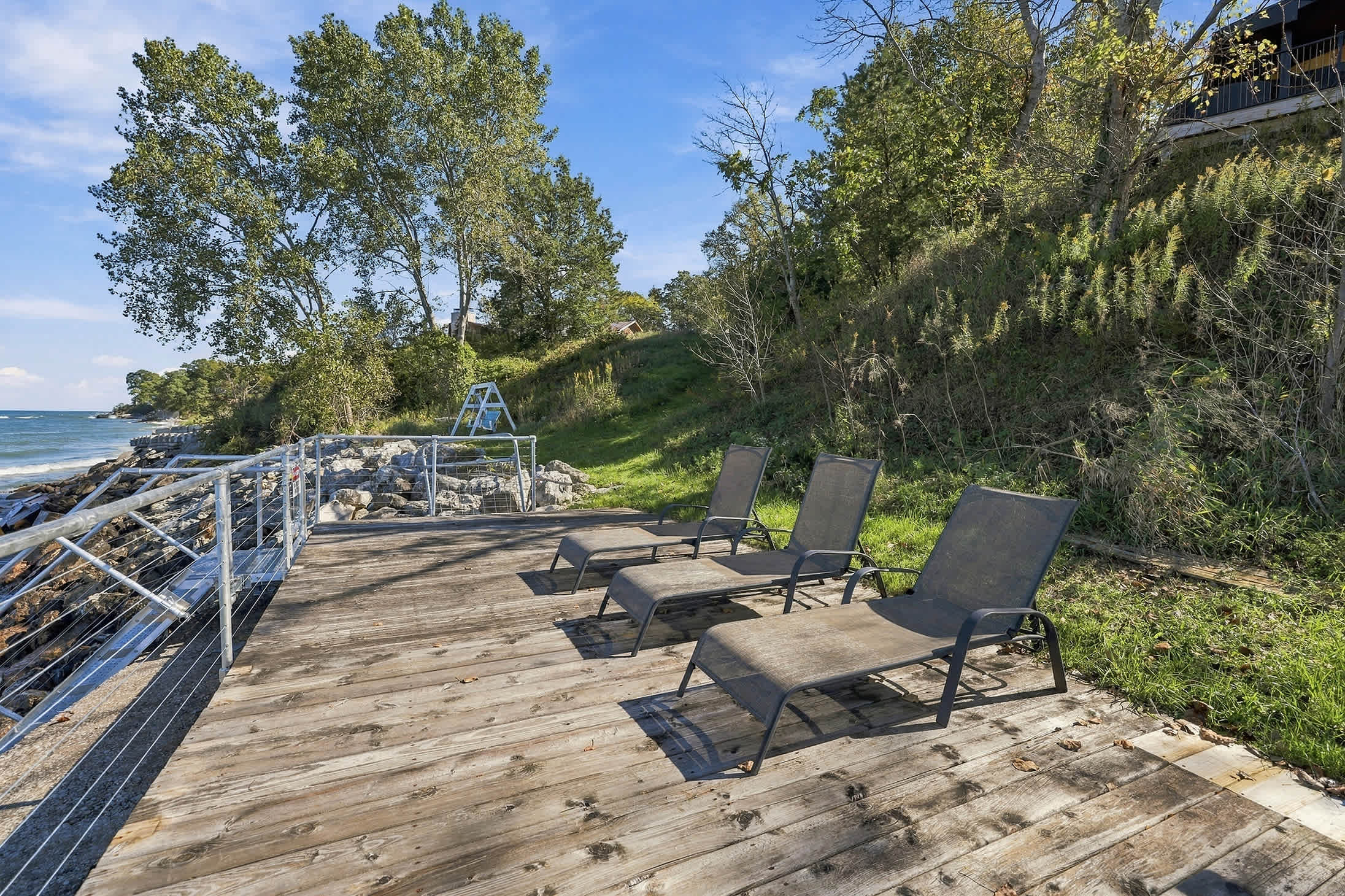 Harbor Country sun deck on Lake Michigan with three loungers and beach access.