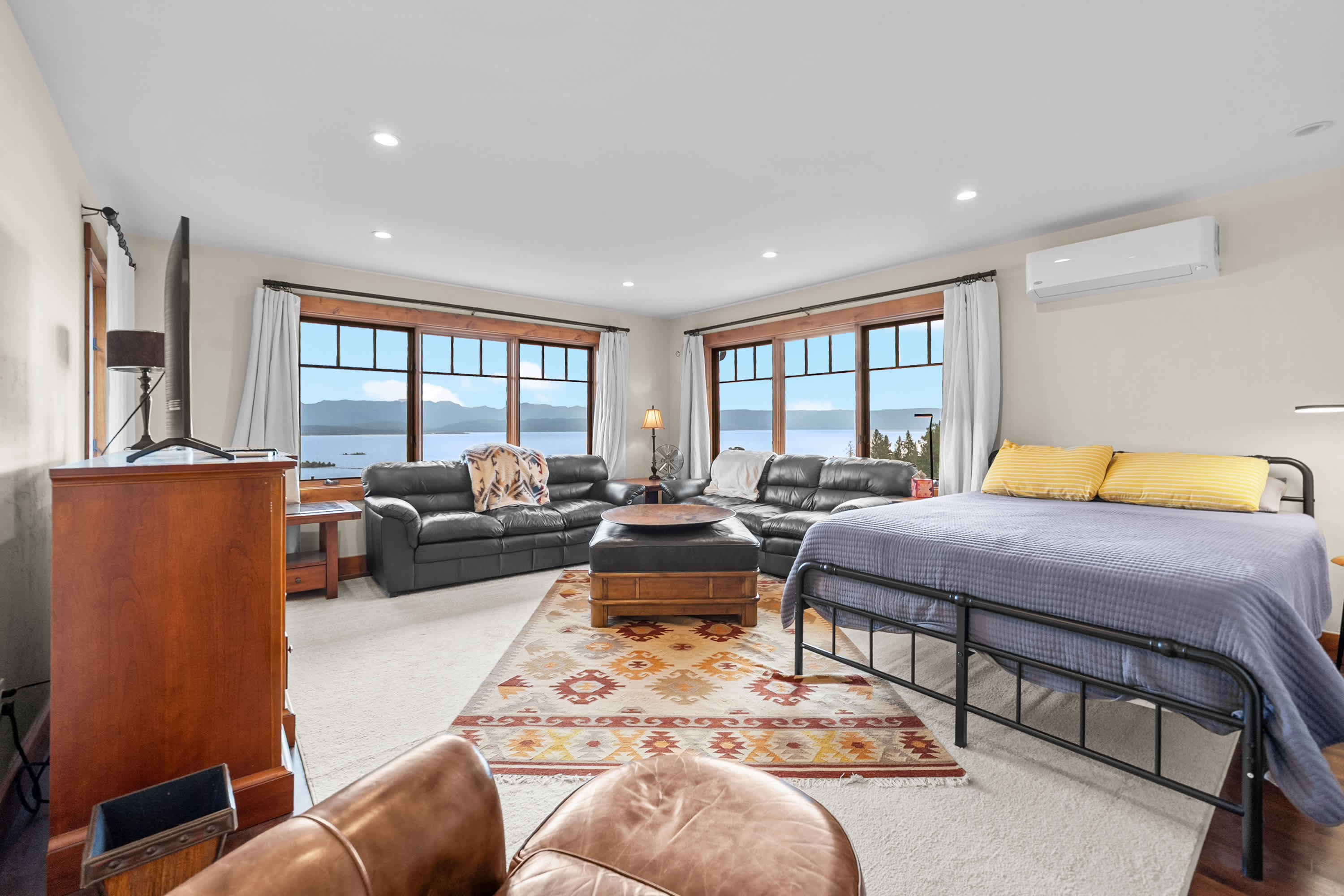 The spacious second suite offers a queen bed, sitting area with smart TV, & an ensuite​