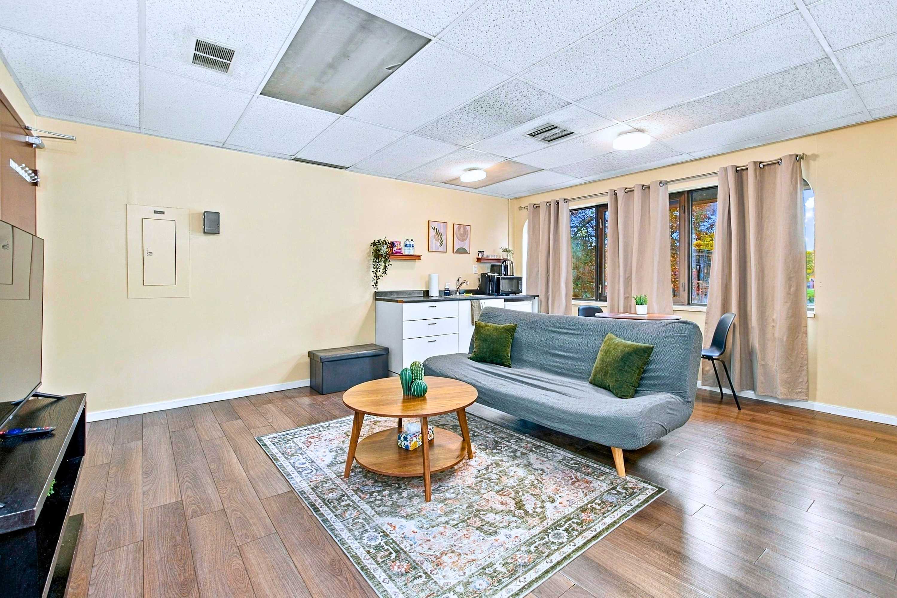 Everything you need in one space: kitchen, dining, and TV lounge