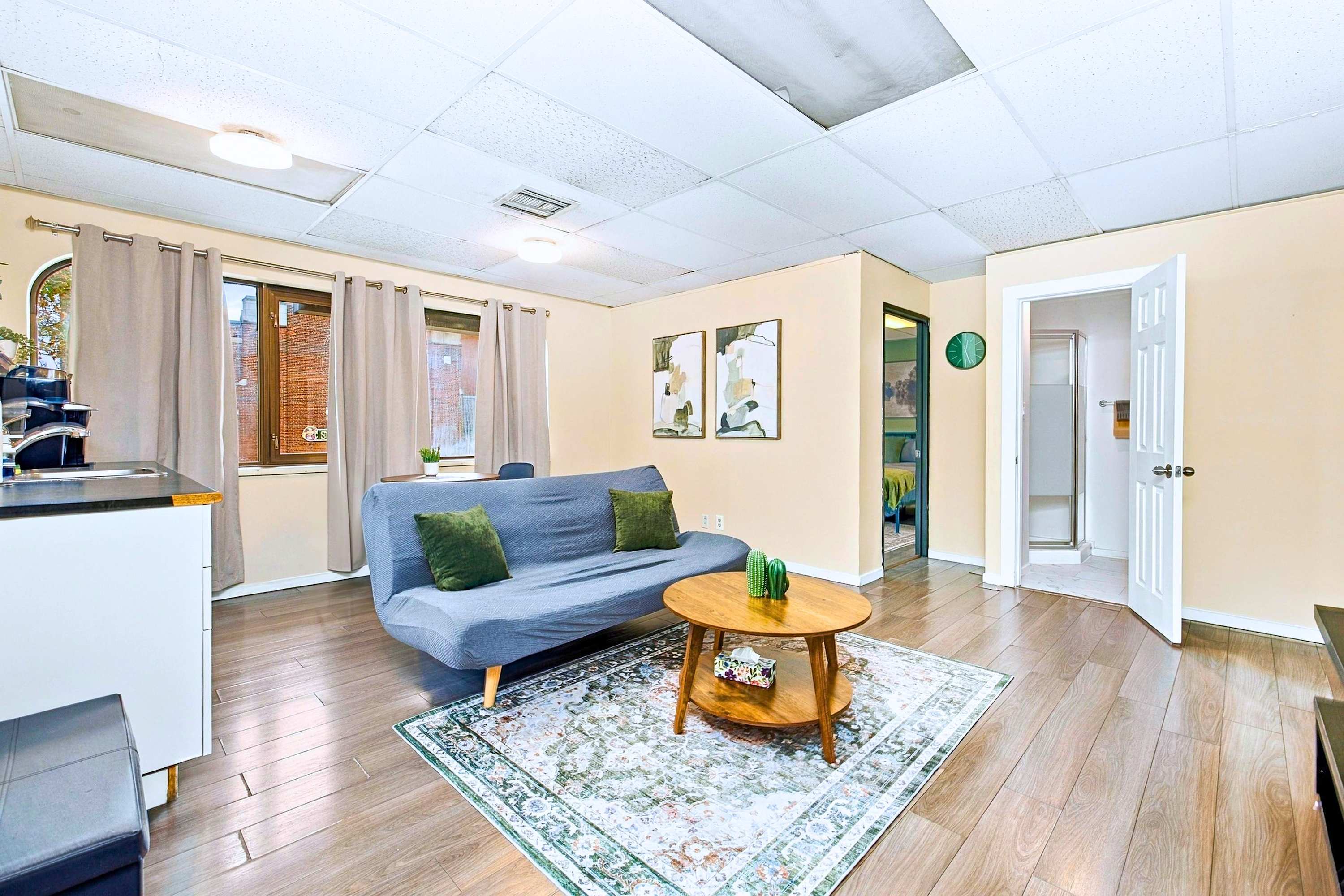 Convenient open layout featuring kitchen, lounge, and easy room access.