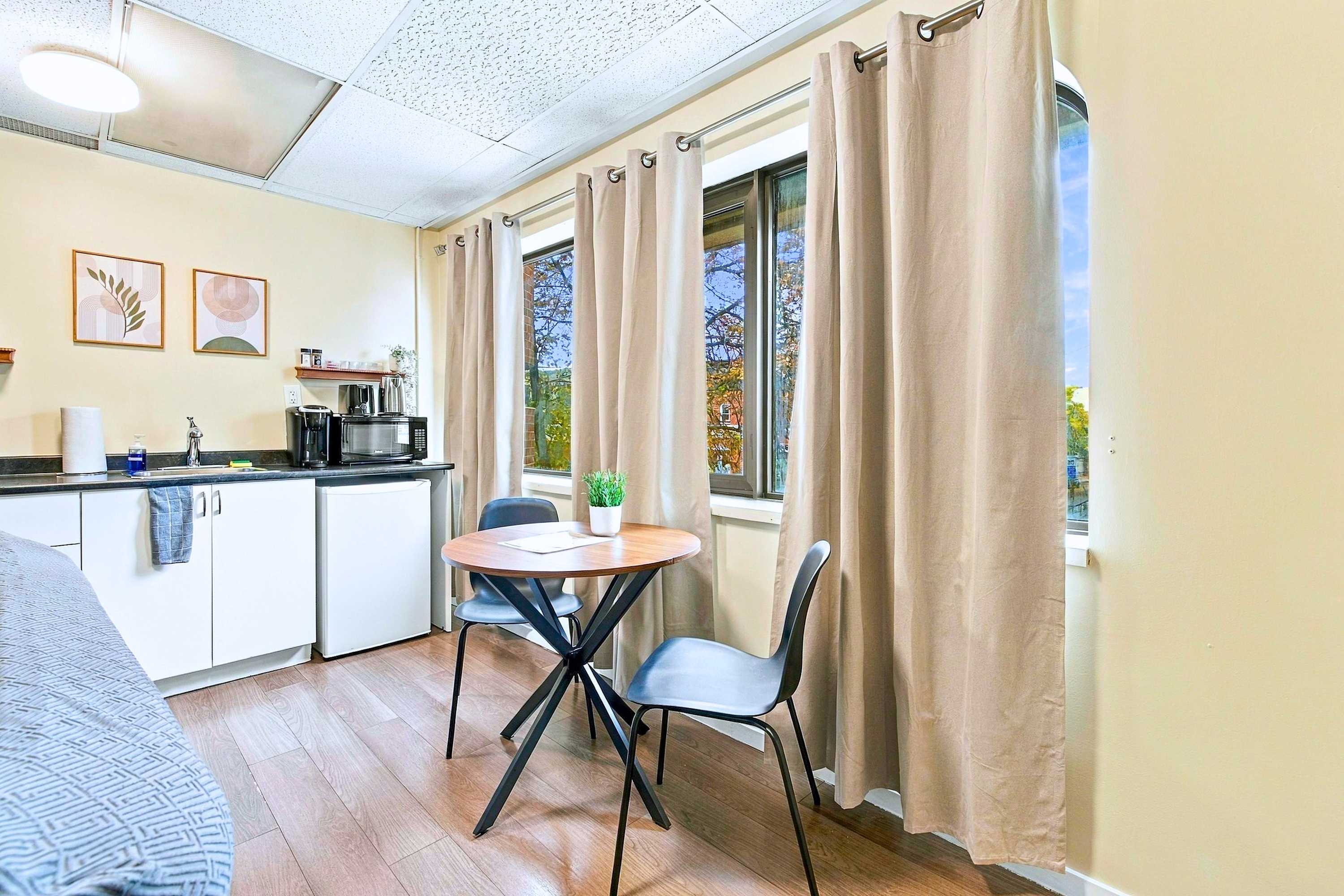 Enjoy private meals and morning coffee at this charming table for two.
