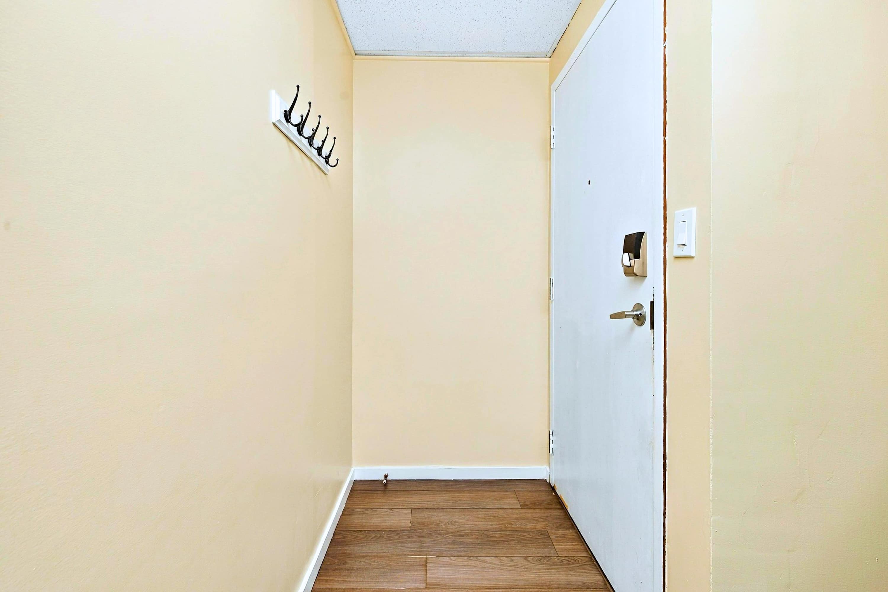 Convenient hallway storage hooks to keep your belongings organized.