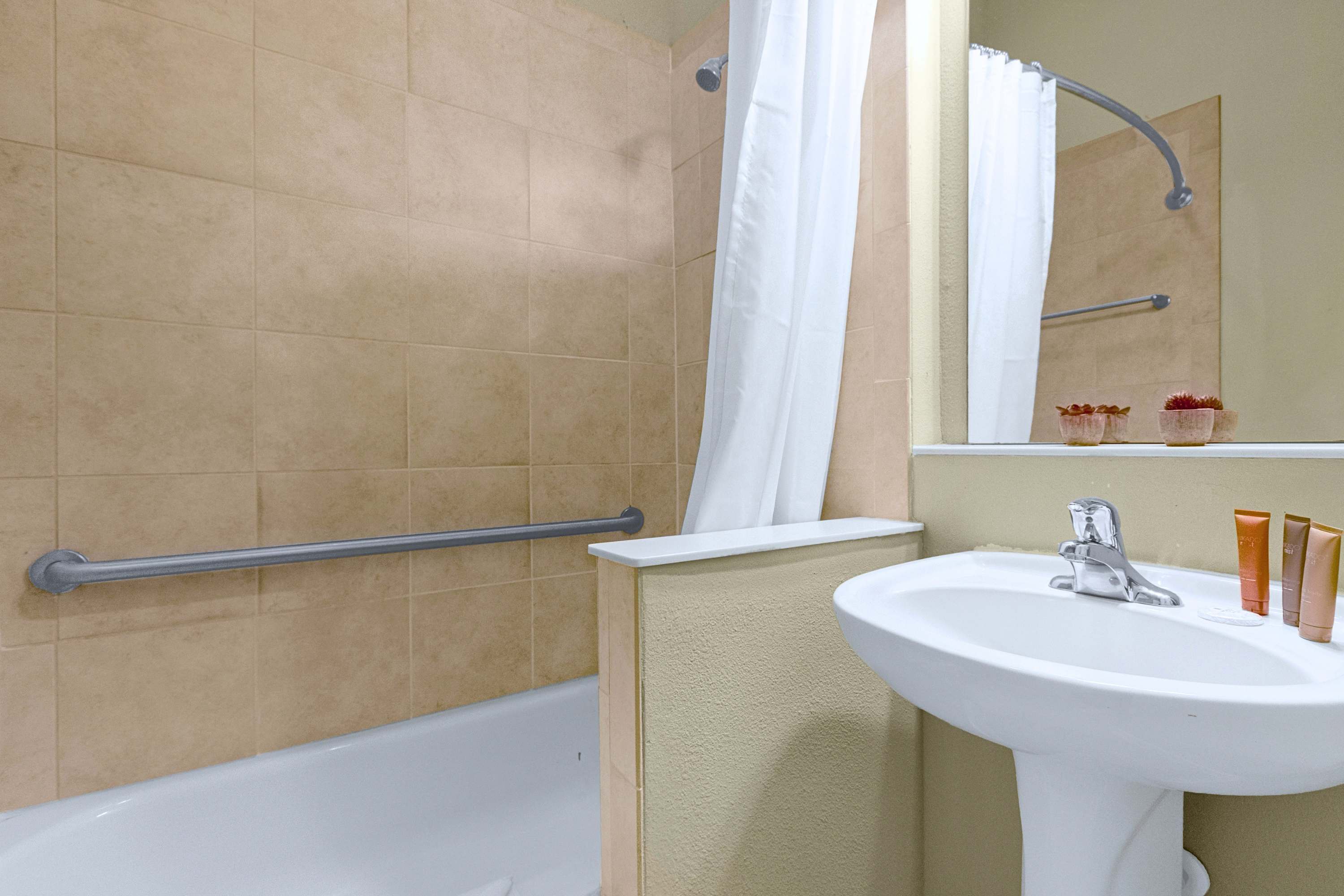 A well-appointed bathroom equipped with modern fixtures and crisp towels