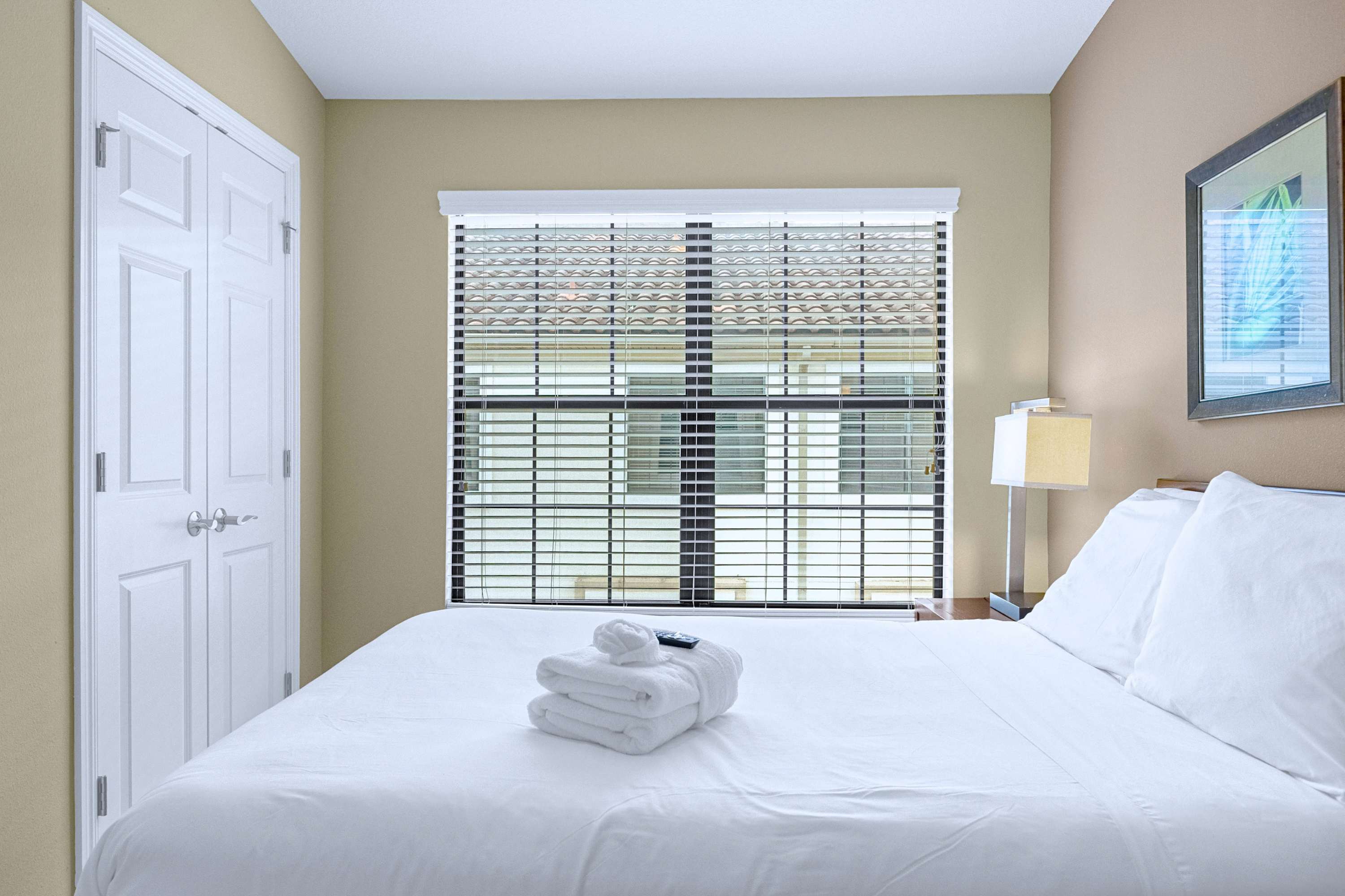 Inviting bedroom setup featuring comfortable bedding and natural sunlight