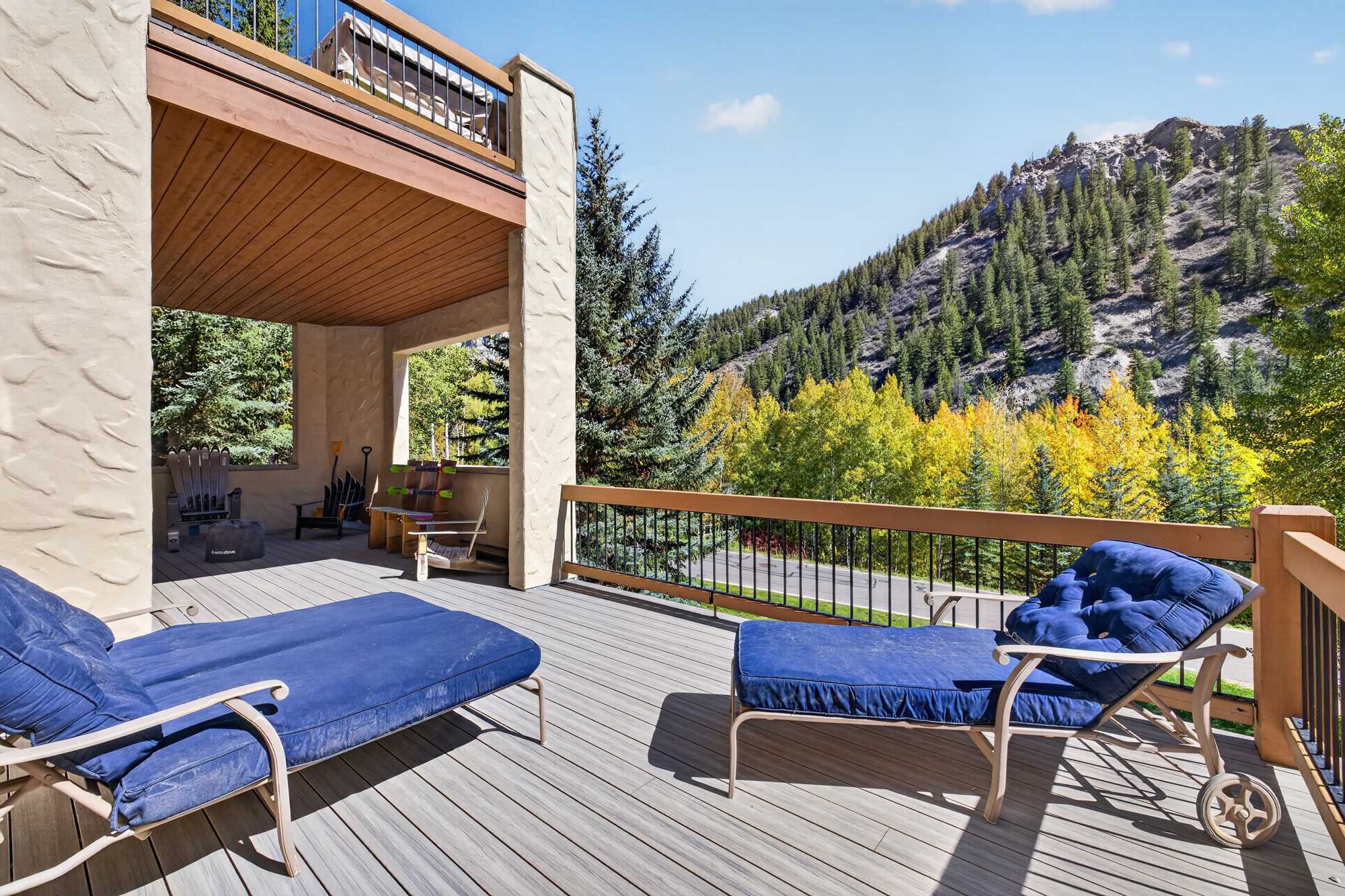 Enjoy mountain views from the covered deck with comfortable outdoor seating