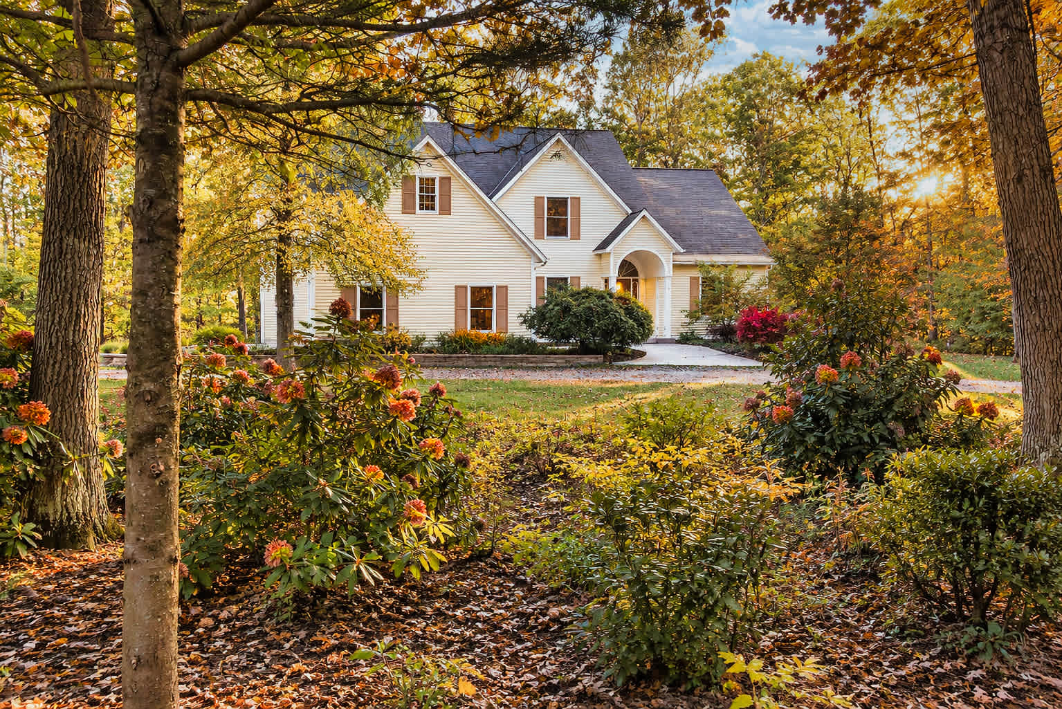 Riverwalk Retreat framed by colorful autumn trees