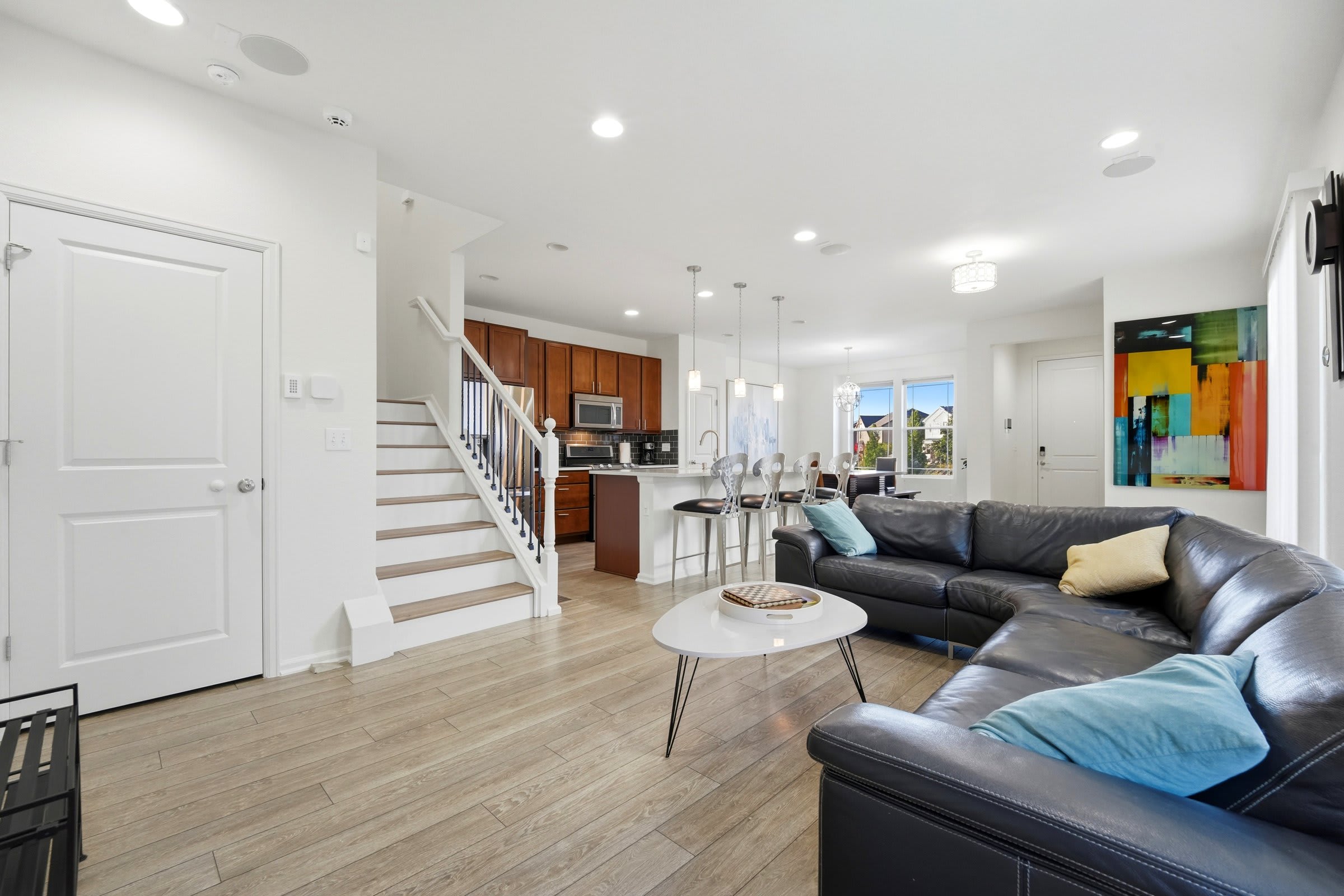 Open living room that flows into the kitchen and dining area