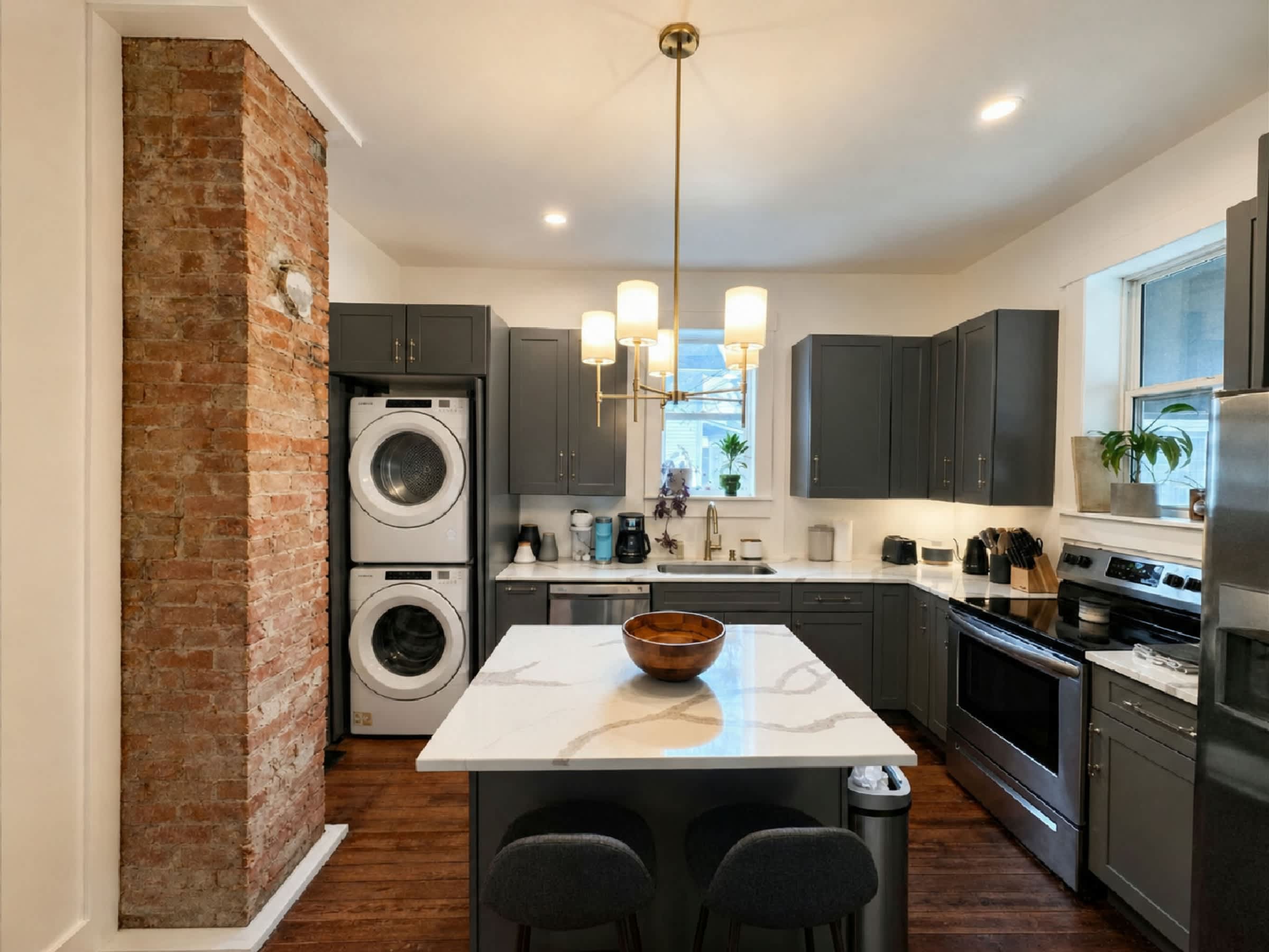 Cook up memories in the spacious kitchen with a large island, bar seating for two, and kitchen essentials, plus a stacked washer and dryer​