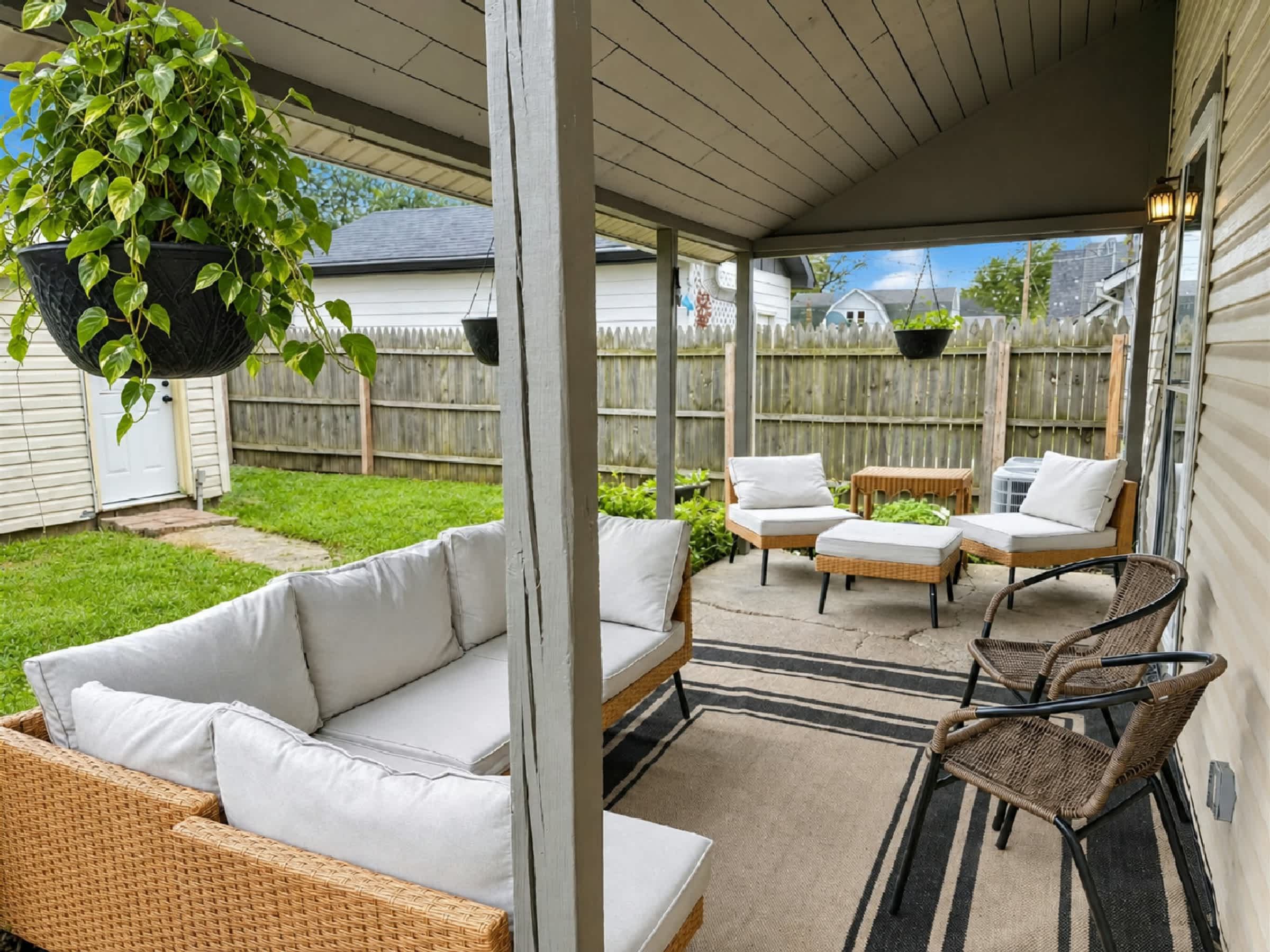 Unwind on the covered backyard patio with plenty of comfortable outdoor seating​