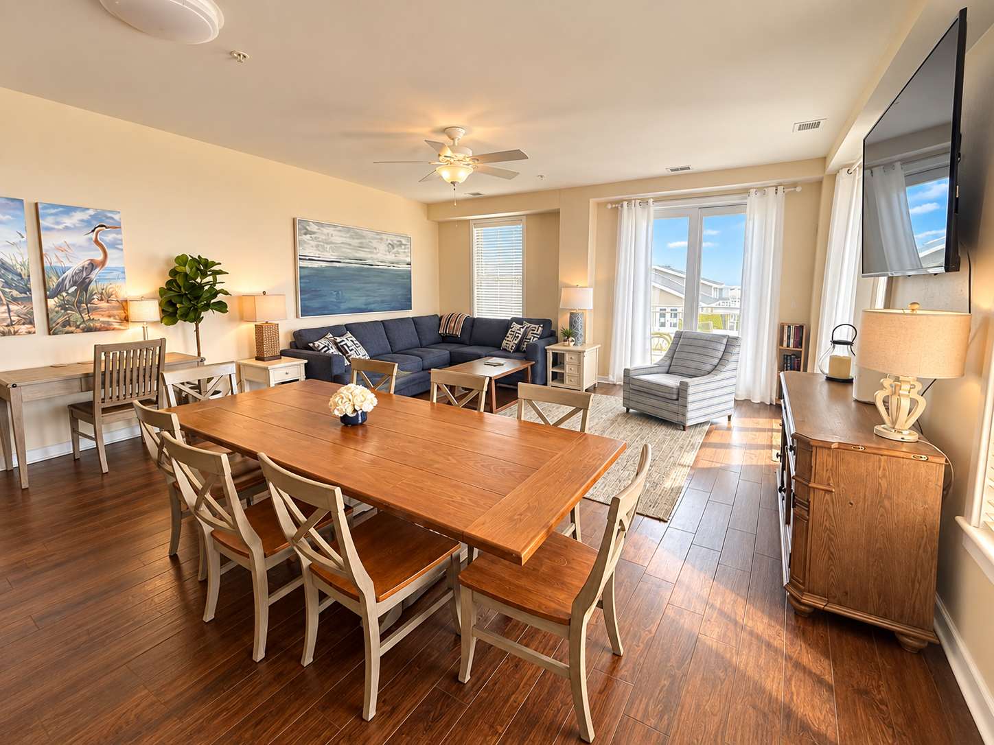 Coastal-themed beachfront condo with water views, washer & dryer, pool, gym & AC