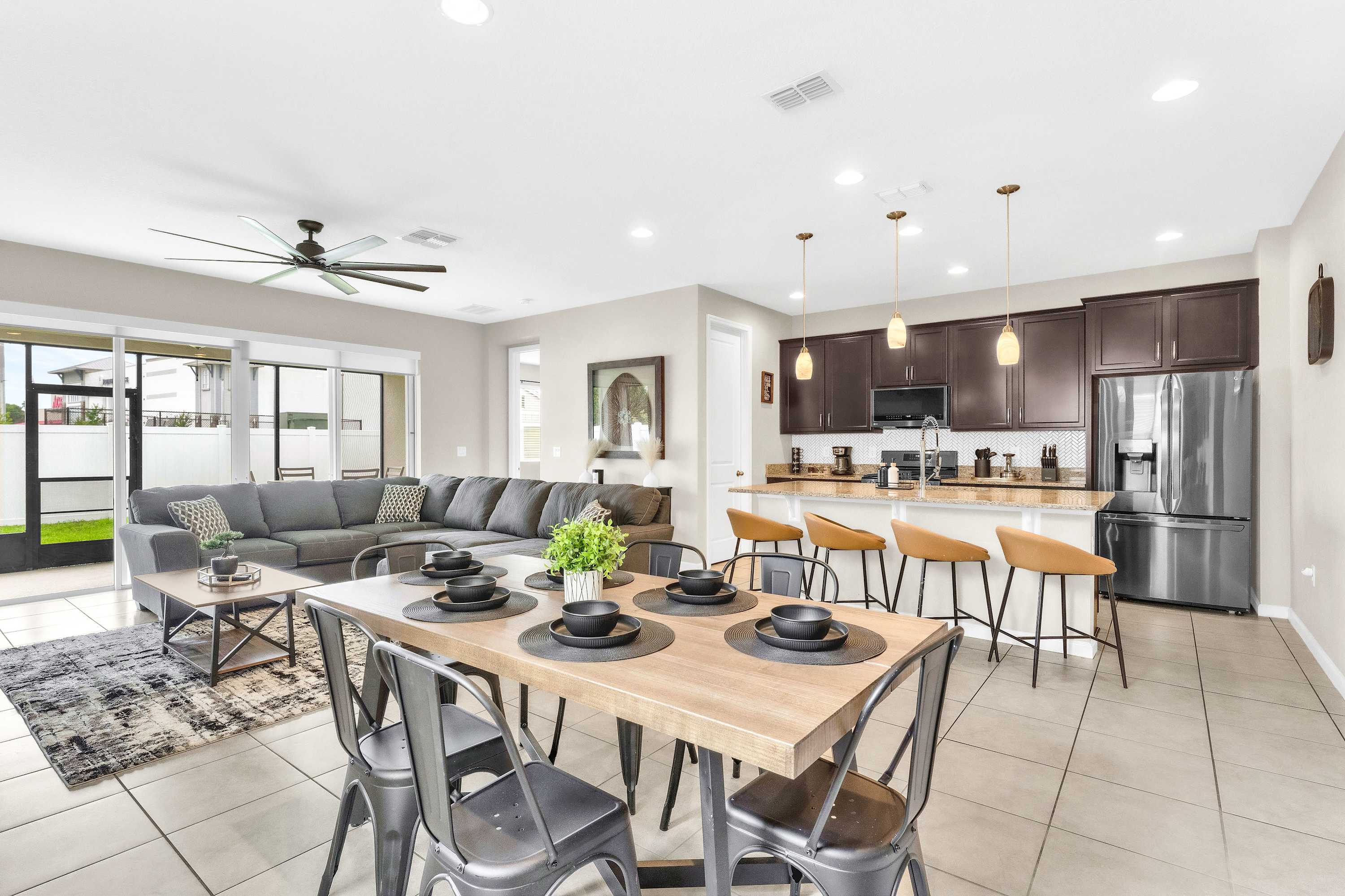 Gather and make memories in the open living area with dining for 6 and kitchen island seating for 4​