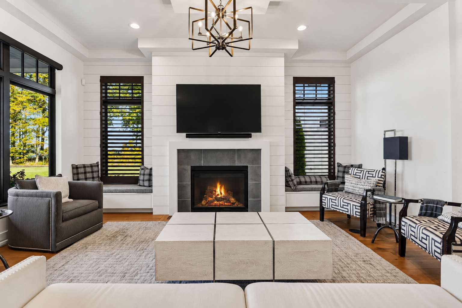 An inviting living room with a fireplace and smart TV at the heart of the home