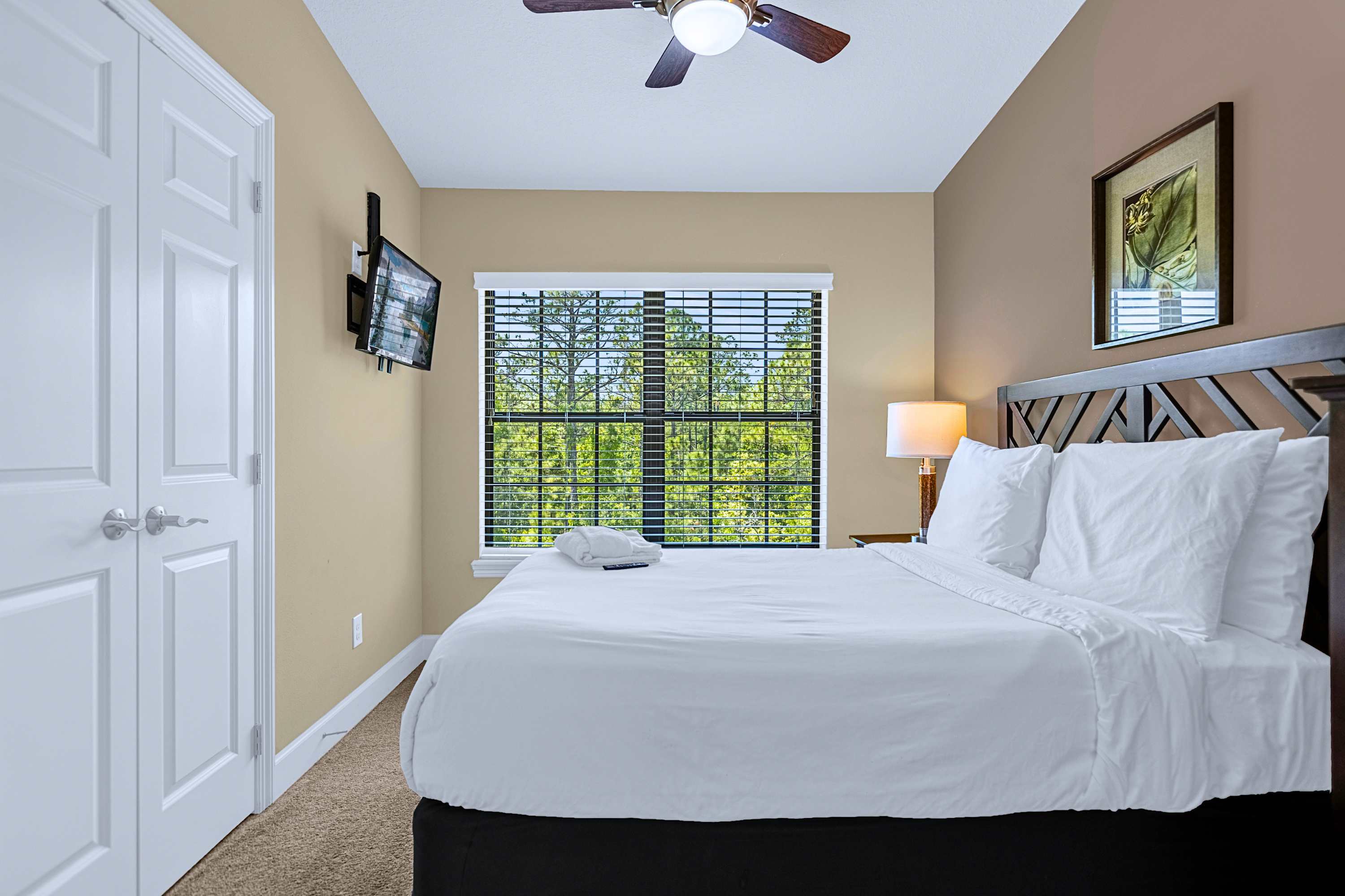 Inviting bedroom setup featuring comfortable bedding and natural sunlight